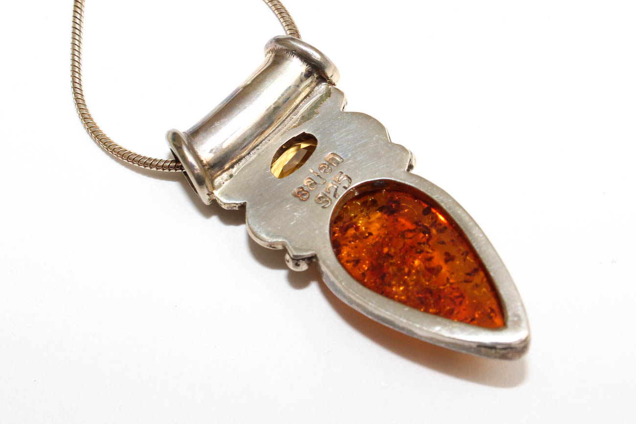 Sterling Silver and Amber Pendants and Figural Brooches including Sajen