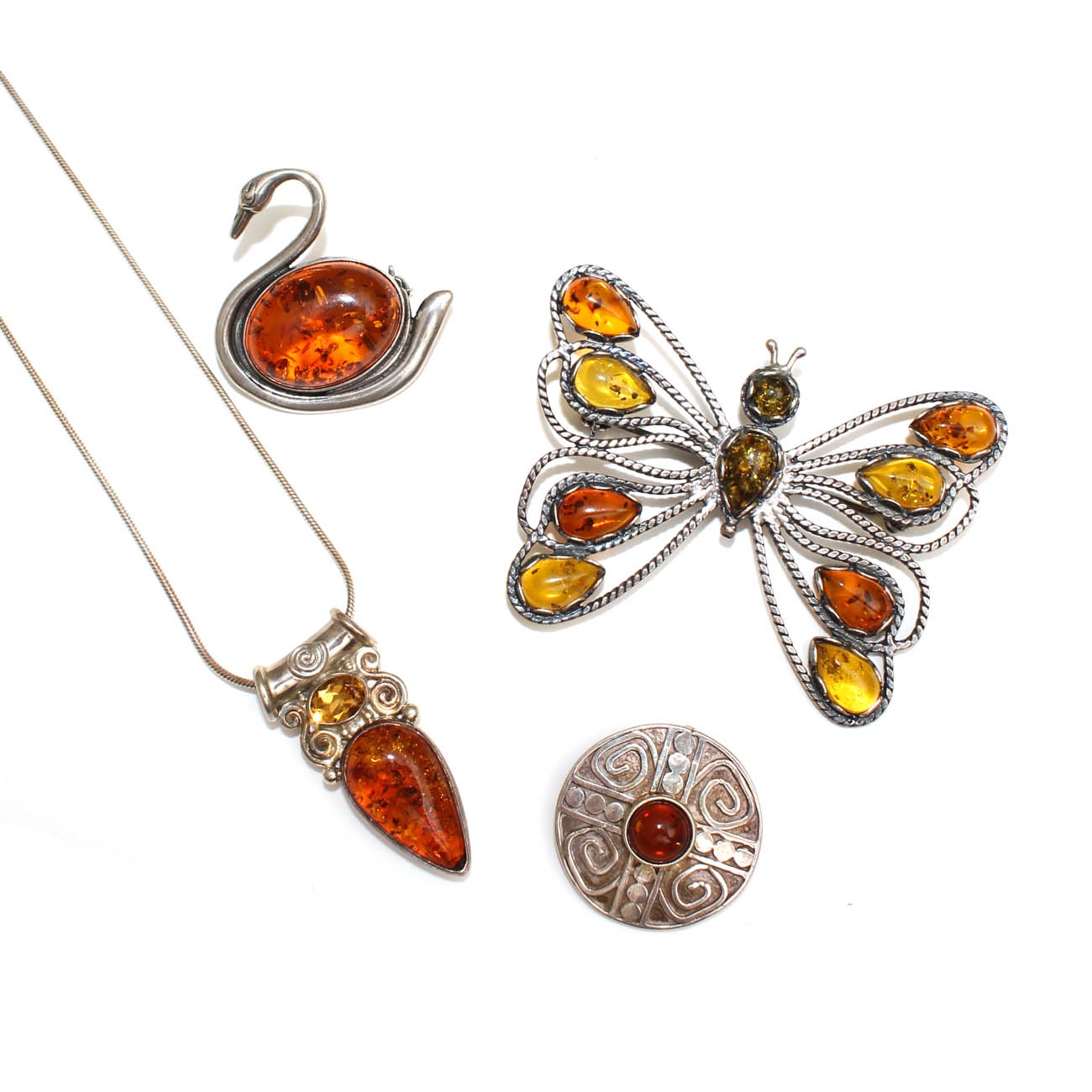 Sterling Silver and Amber Pendants and Figural Brooches including Sajen