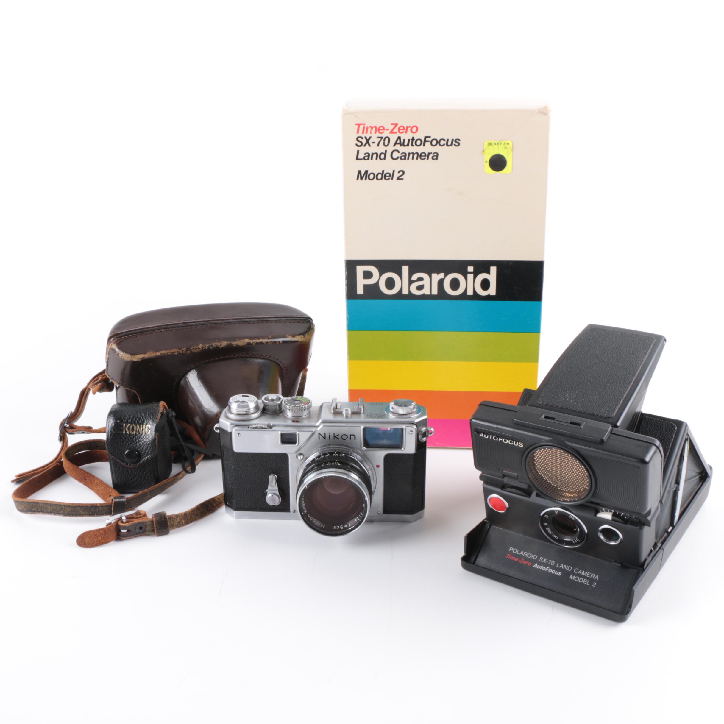 Vintage Polaroid SX-70 Land Camera Model 2 and Nikon Rangefinder Camera