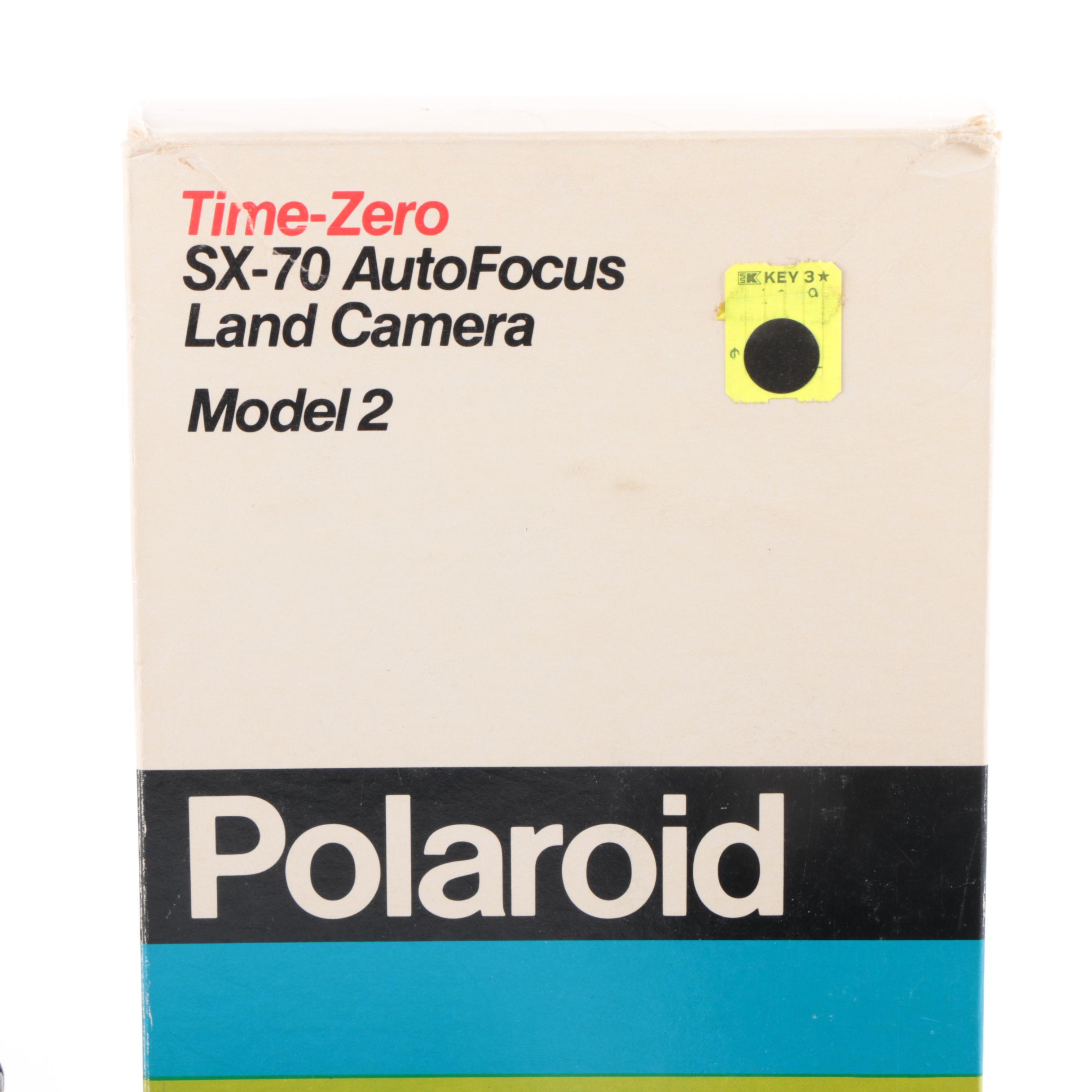 Vintage Polaroid SX-70 Land Camera Model 2 and Nikon Rangefinder Camera