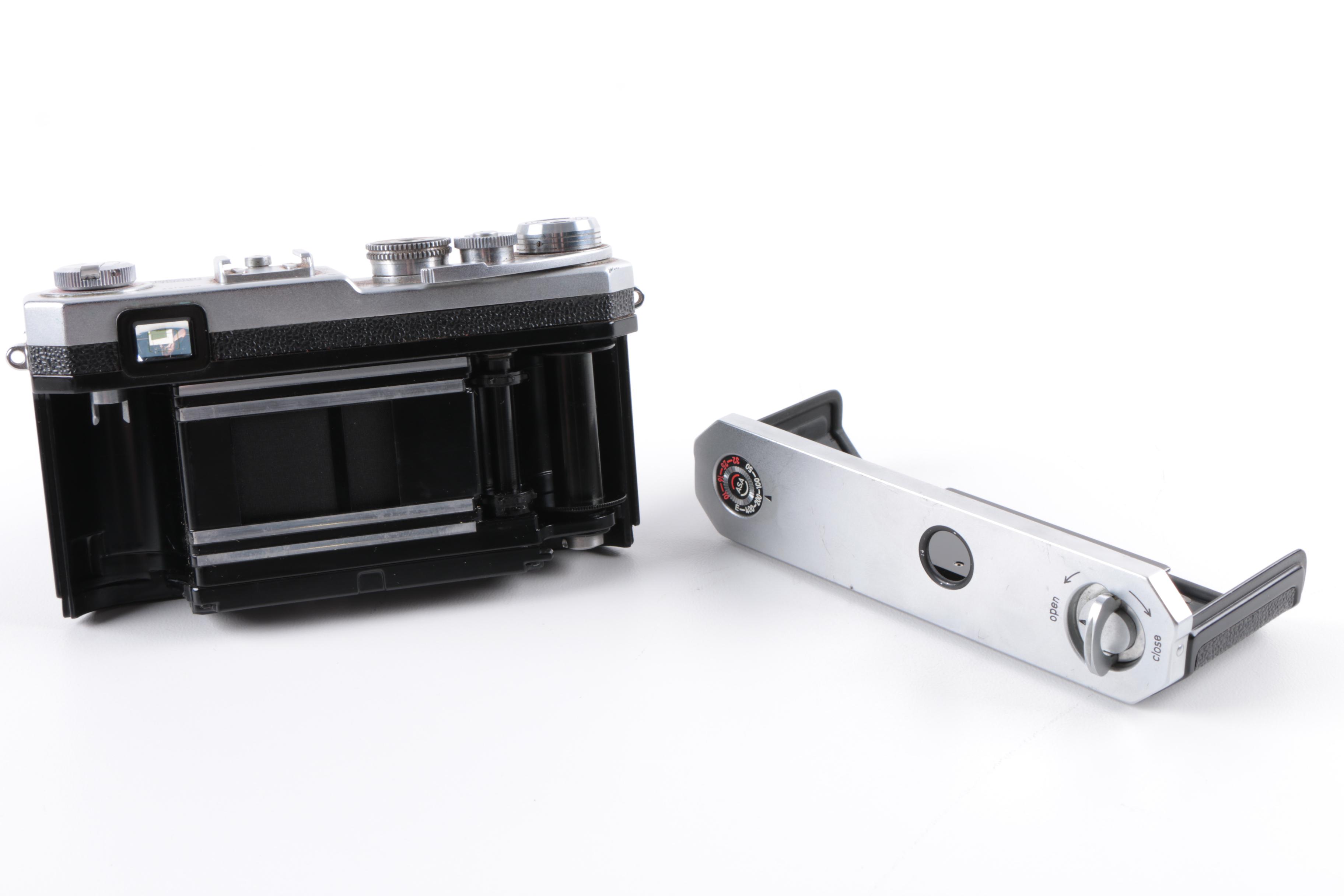 Vintage Polaroid SX-70 Land Camera Model 2 and Nikon Rangefinder Camera