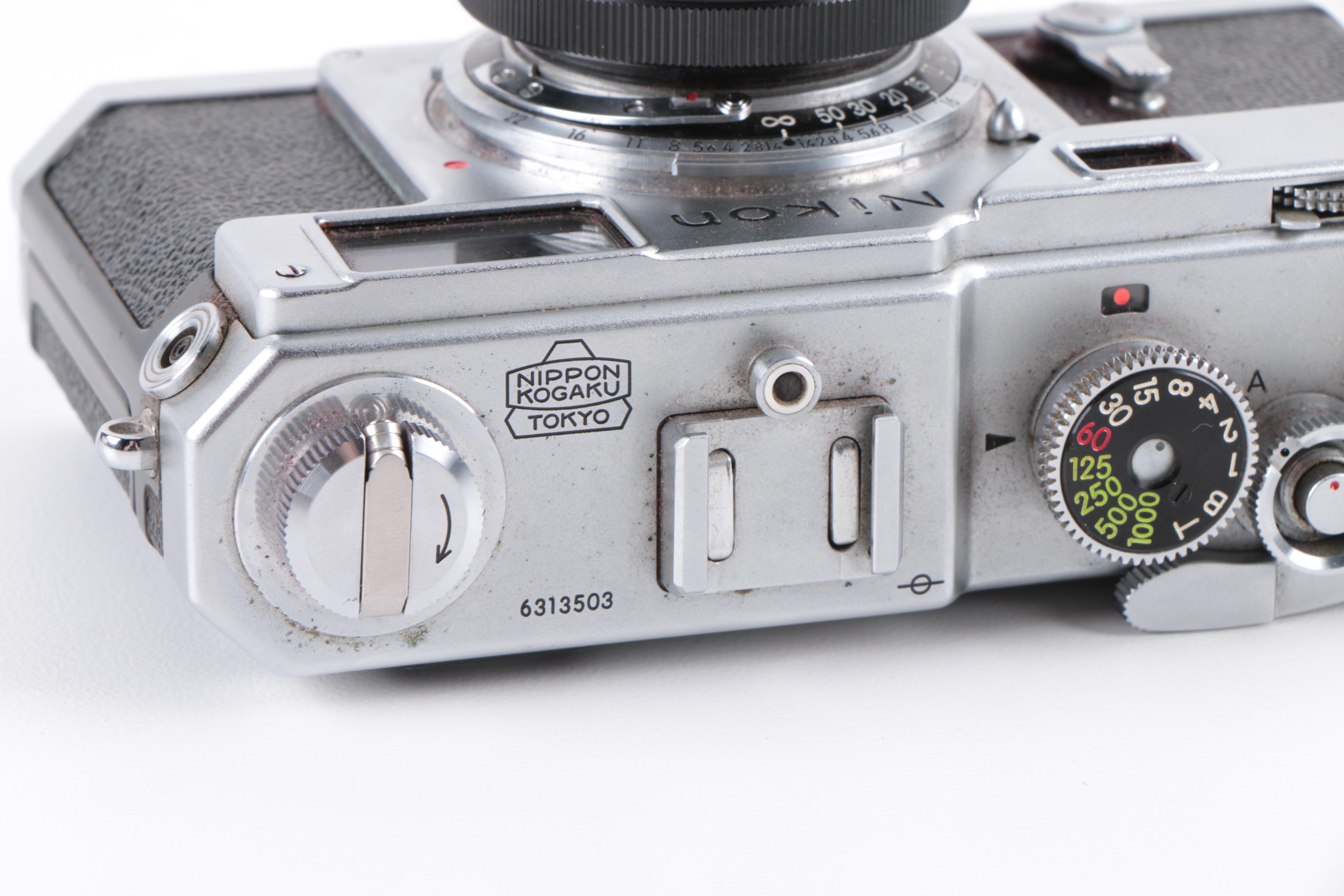 Vintage Polaroid SX-70 Land Camera Model 2 and Nikon Rangefinder Camera