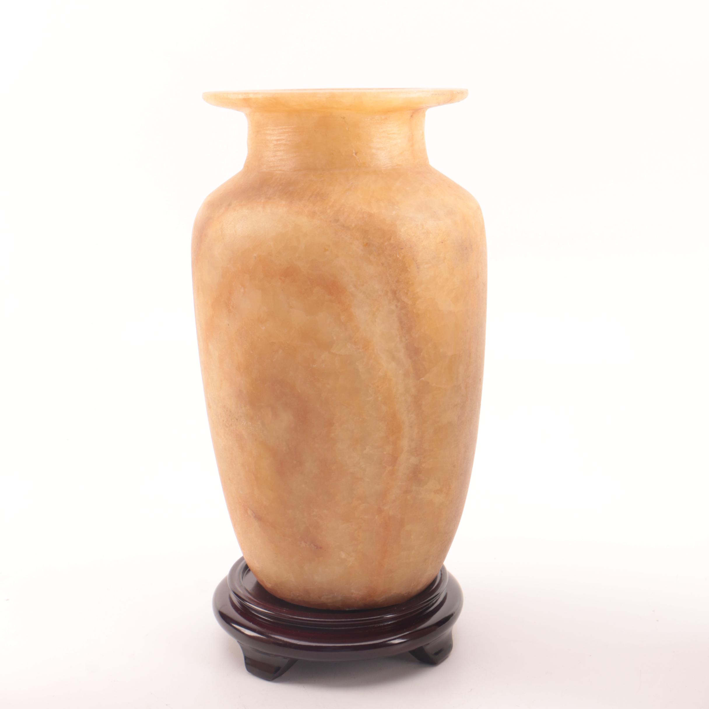 Carved Alabaster Vases and a Resin Candlestick Holder