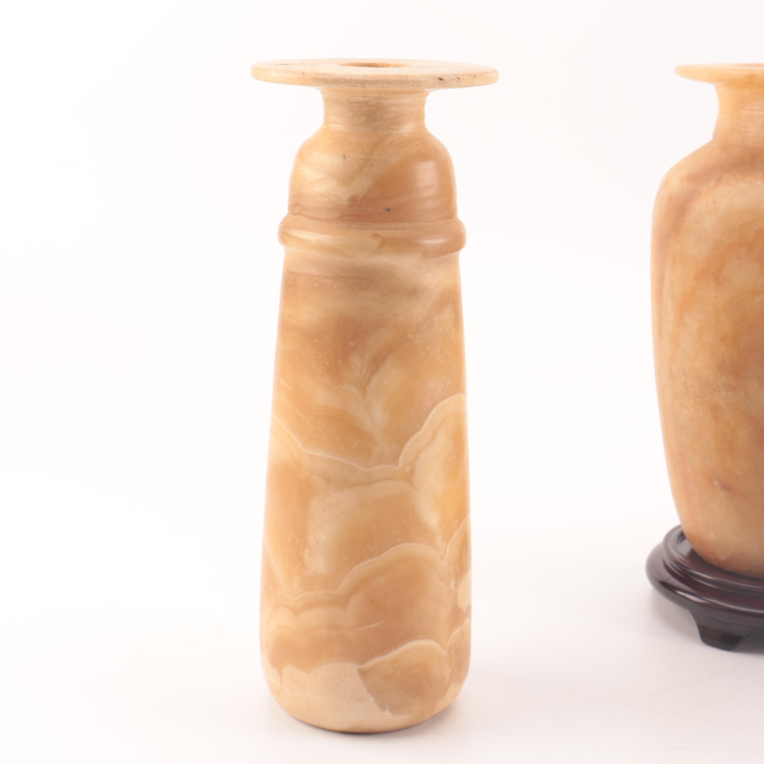 Carved Alabaster Vases and a Resin Candlestick Holder