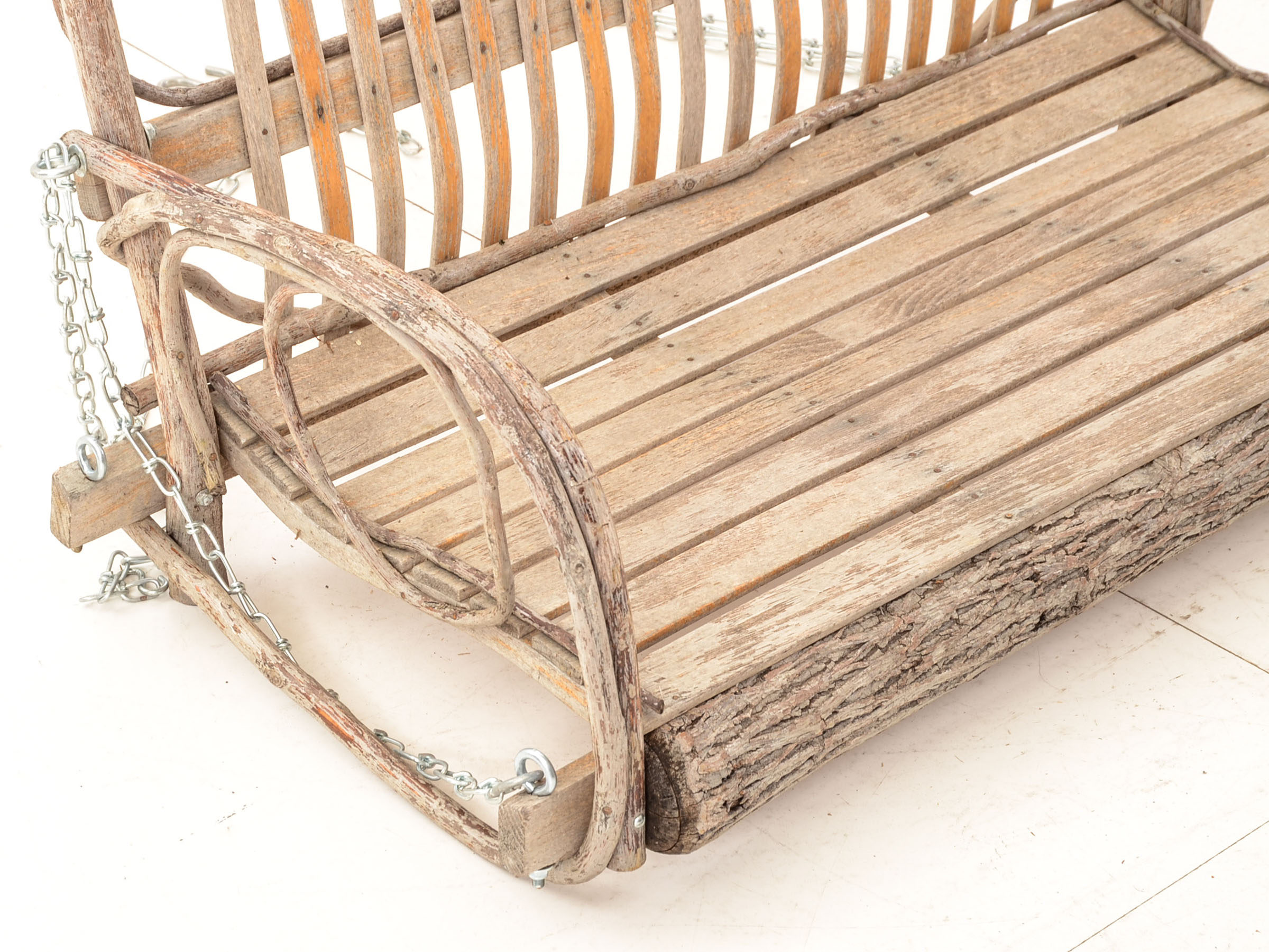 Rustic Branch and Wood Constructed Porch Swing