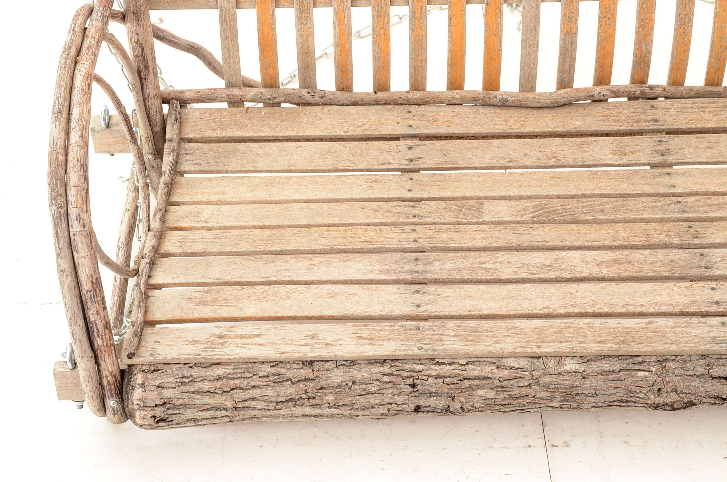 Rustic Branch and Wood Constructed Porch Swing