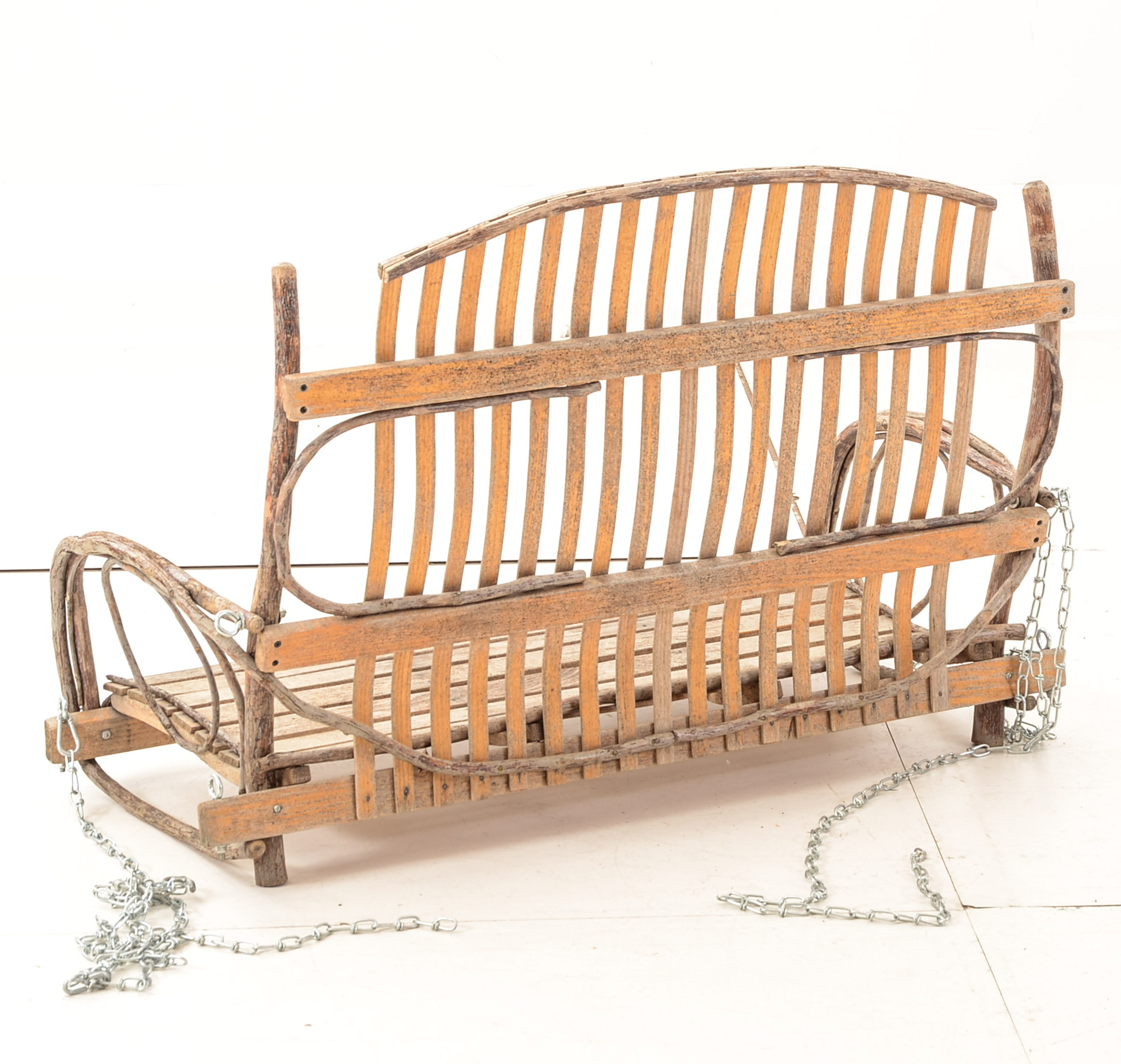 Rustic Branch and Wood Constructed Porch Swing