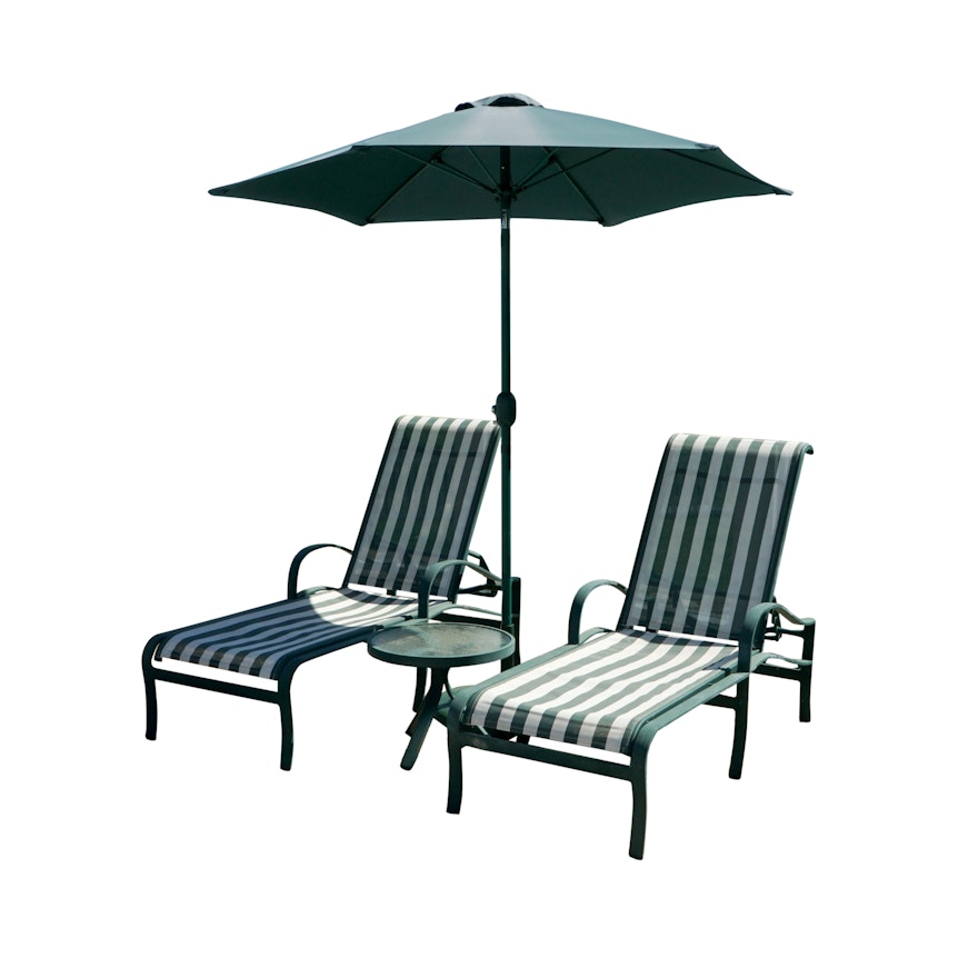 Chaise Lounges with Glass Top Side Tables and Patio Umbrellas