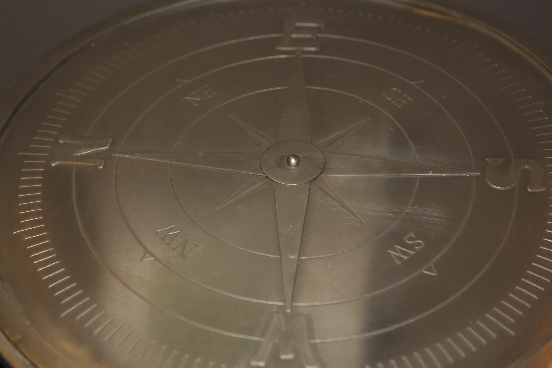 Round Metal Accent Table with Cardinal Points