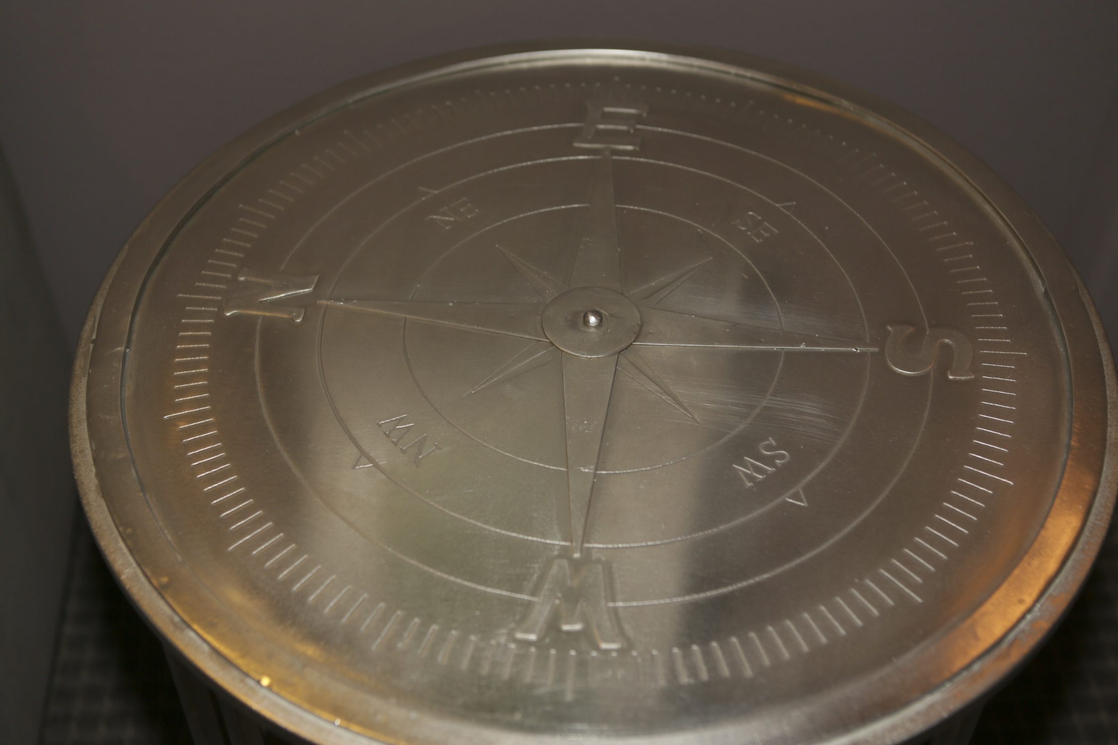 Round Metal Accent Table with Cardinal Points