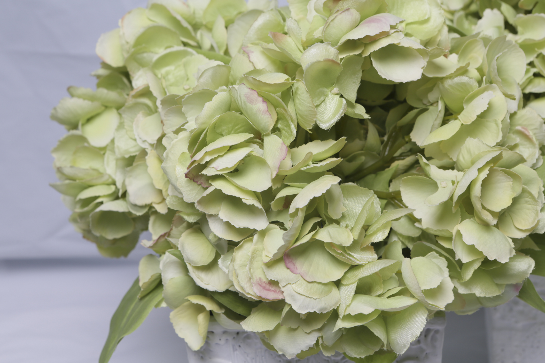 Faux Hydrangea Blooms in Ornate Ceramic Planters