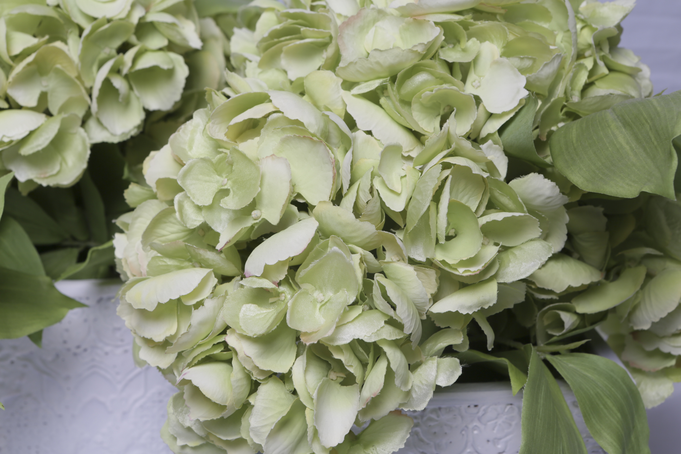 Faux Hydrangea Blooms in Ornate Ceramic Planters