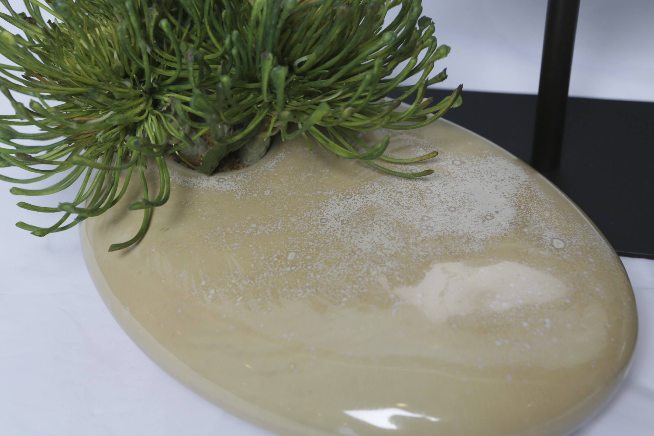 Marble Disk Sculptures on Stands and Silk Plants