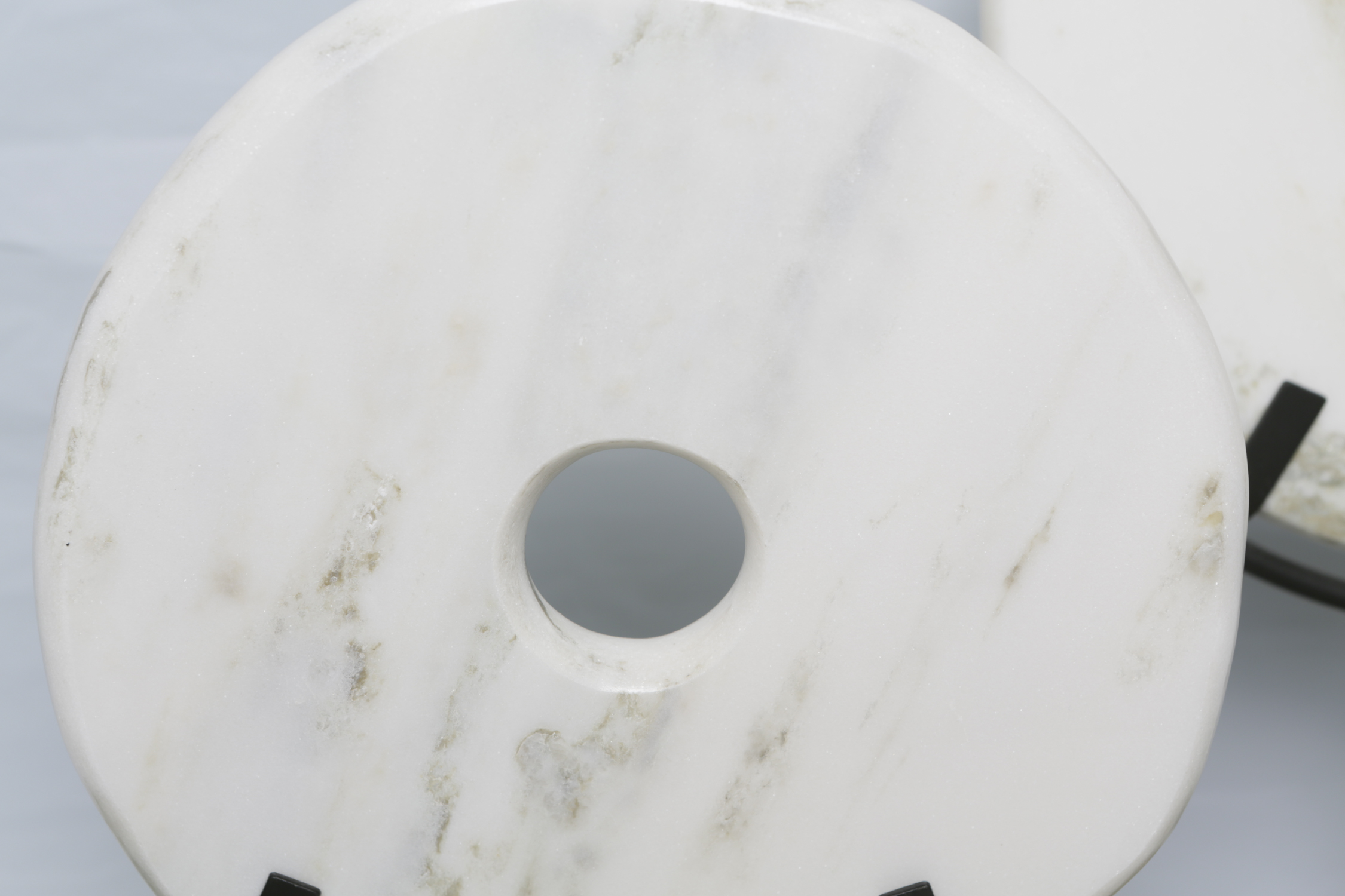 Marble Disk Sculptures on Stands and Silk Plants