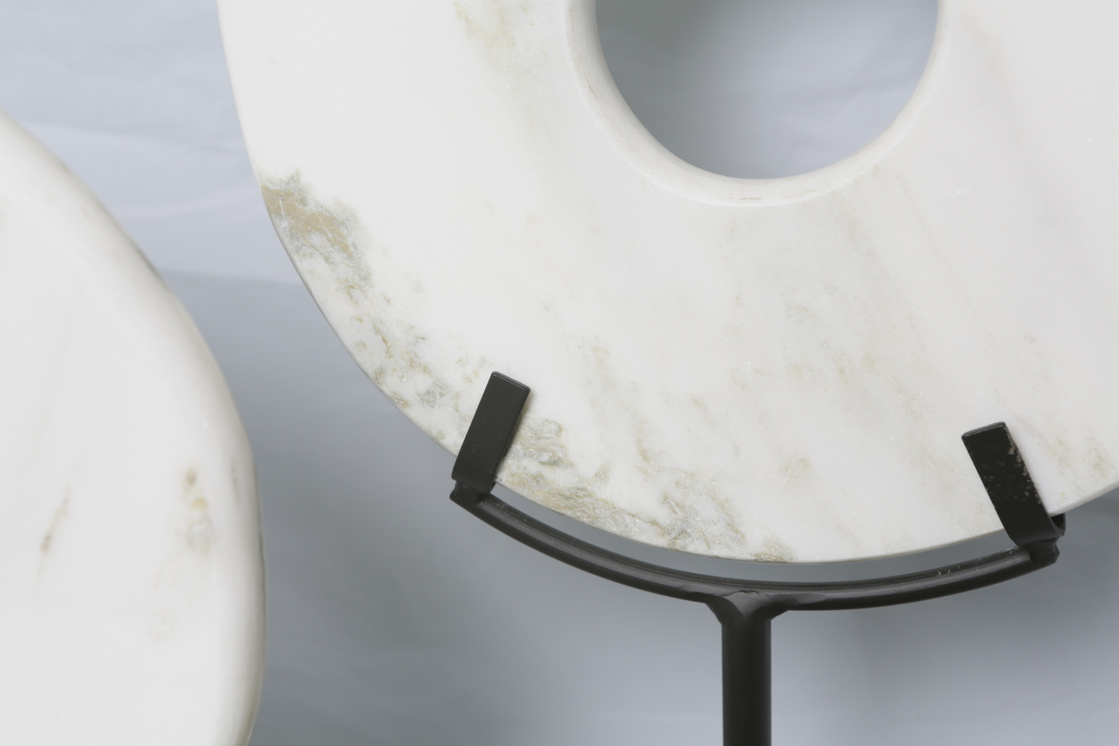 Marble Disk Sculptures on Stands and Silk Plants