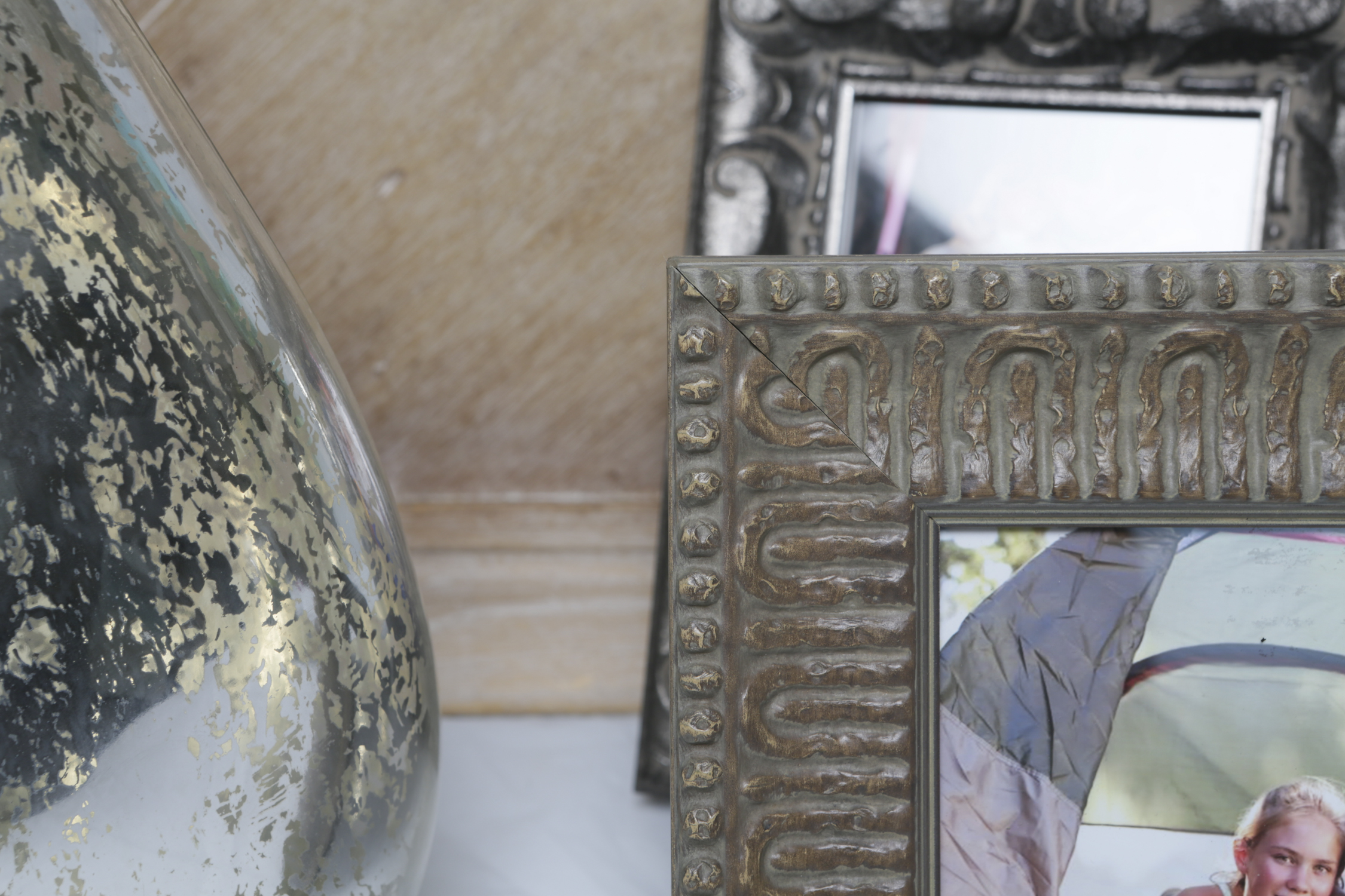 Eclectic Home Decor with Mercury-Style Glass Vases and Picture Frames