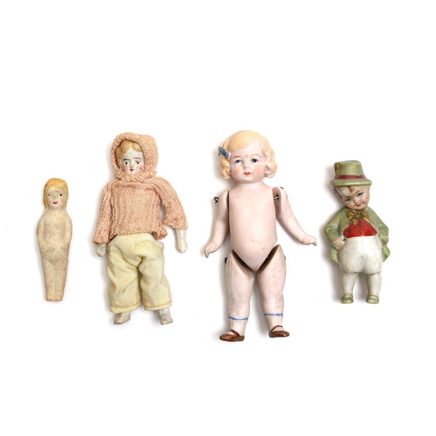 Four Small Bisque Dolls