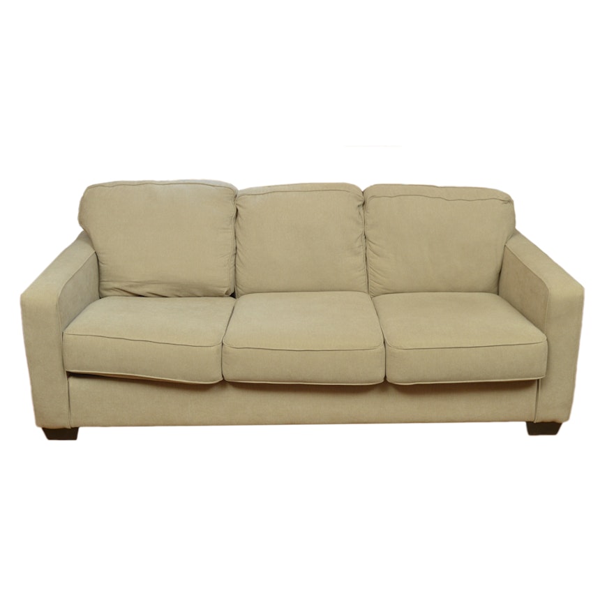 Tan Upholstered Three Cushion Sofa by Ashley Furniture