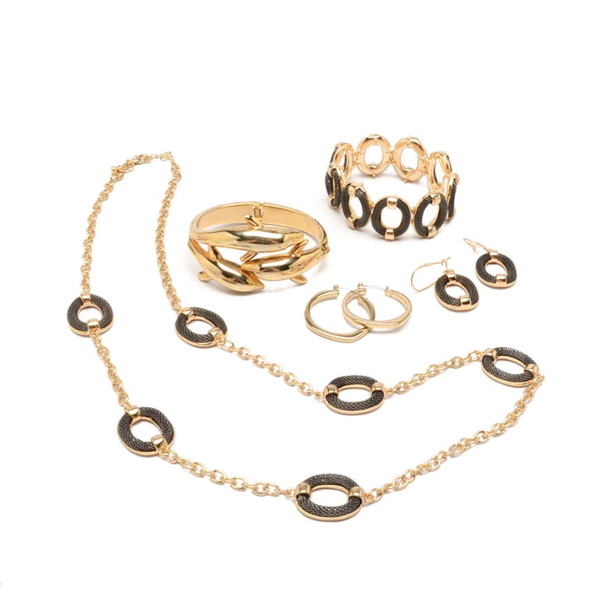 Gold Tone Jewelry Set with a Dolphin Cuff Bracelet and Hoop Earrings