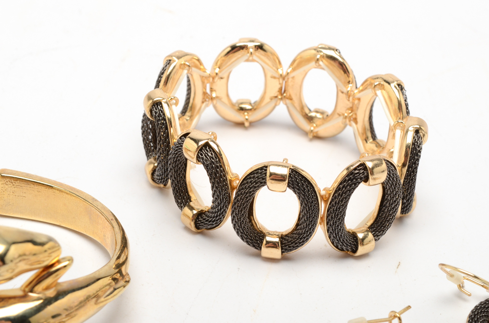 Gold Tone Jewelry Set with a Dolphin Cuff Bracelet and Hoop Earrings