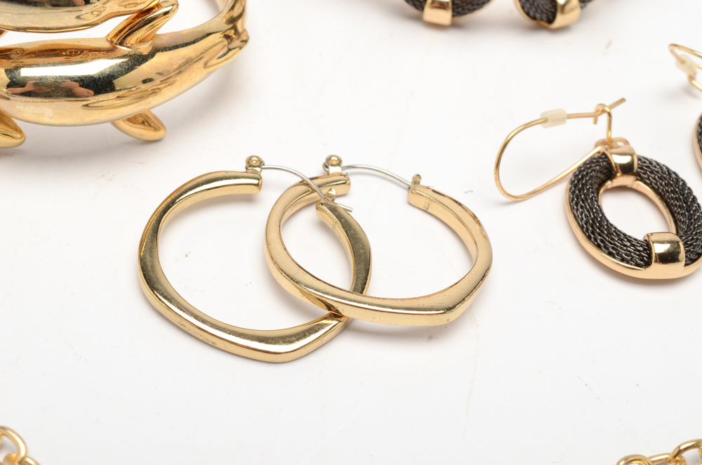 Gold Tone Jewelry Set with a Dolphin Cuff Bracelet and Hoop Earrings