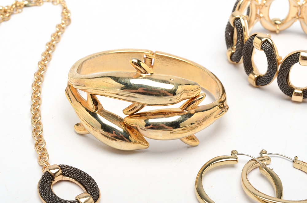 Gold Tone Jewelry Set with a Dolphin Cuff Bracelet and Hoop Earrings