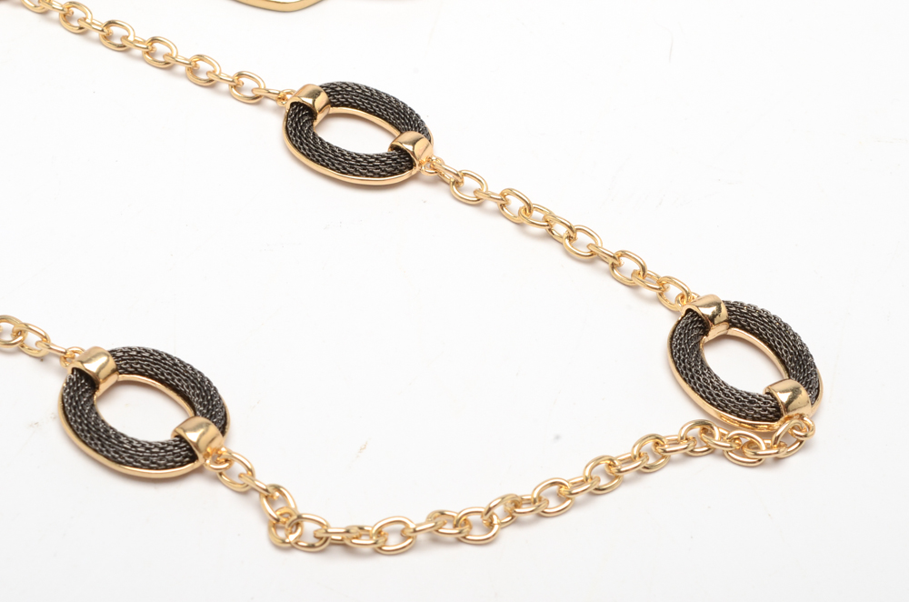 Gold Tone Jewelry Set with a Dolphin Cuff Bracelet and Hoop Earrings