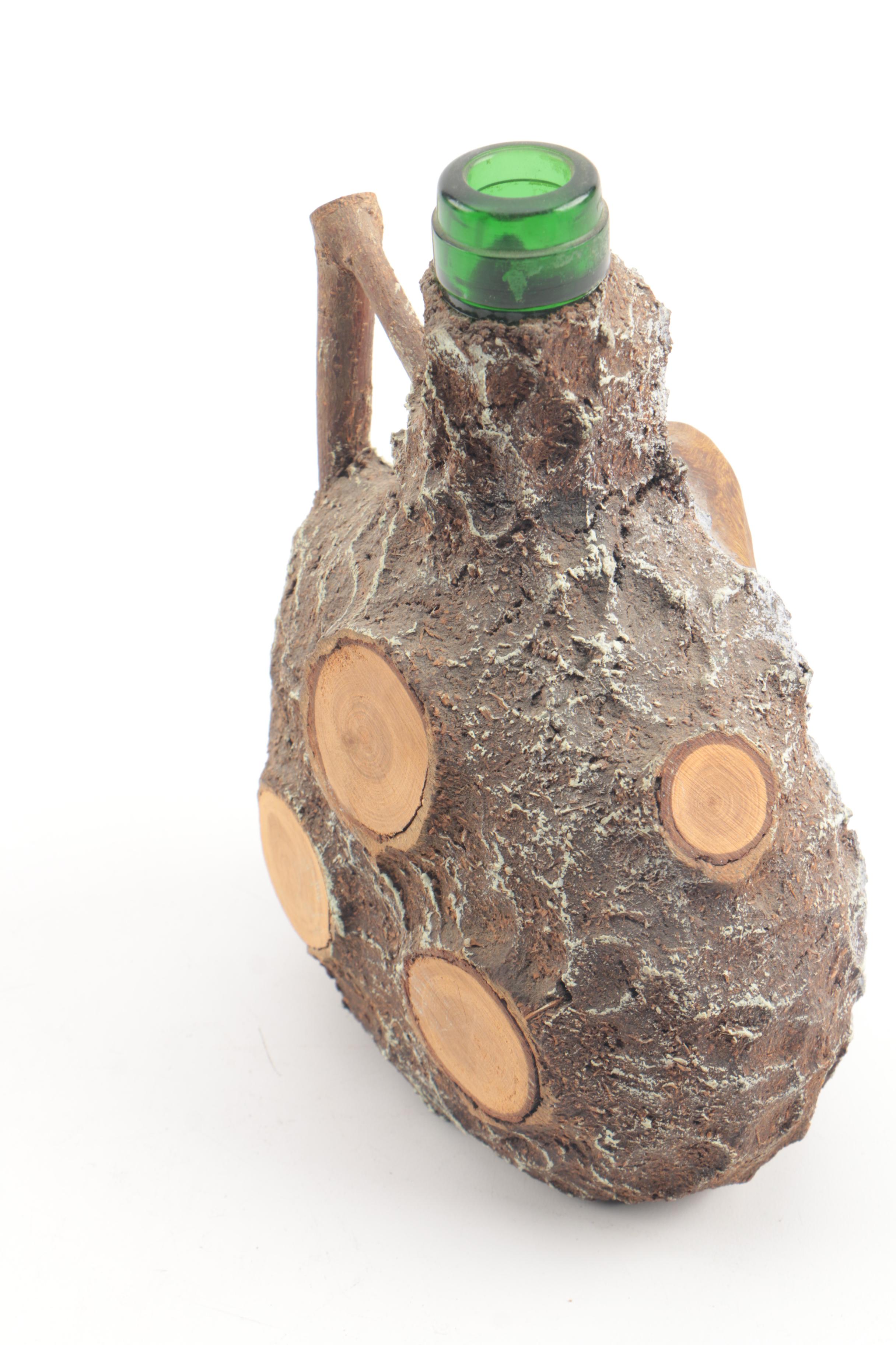 Vintage Folk Art Glass Bottle with Carved Wooden Face and Bark Exterior