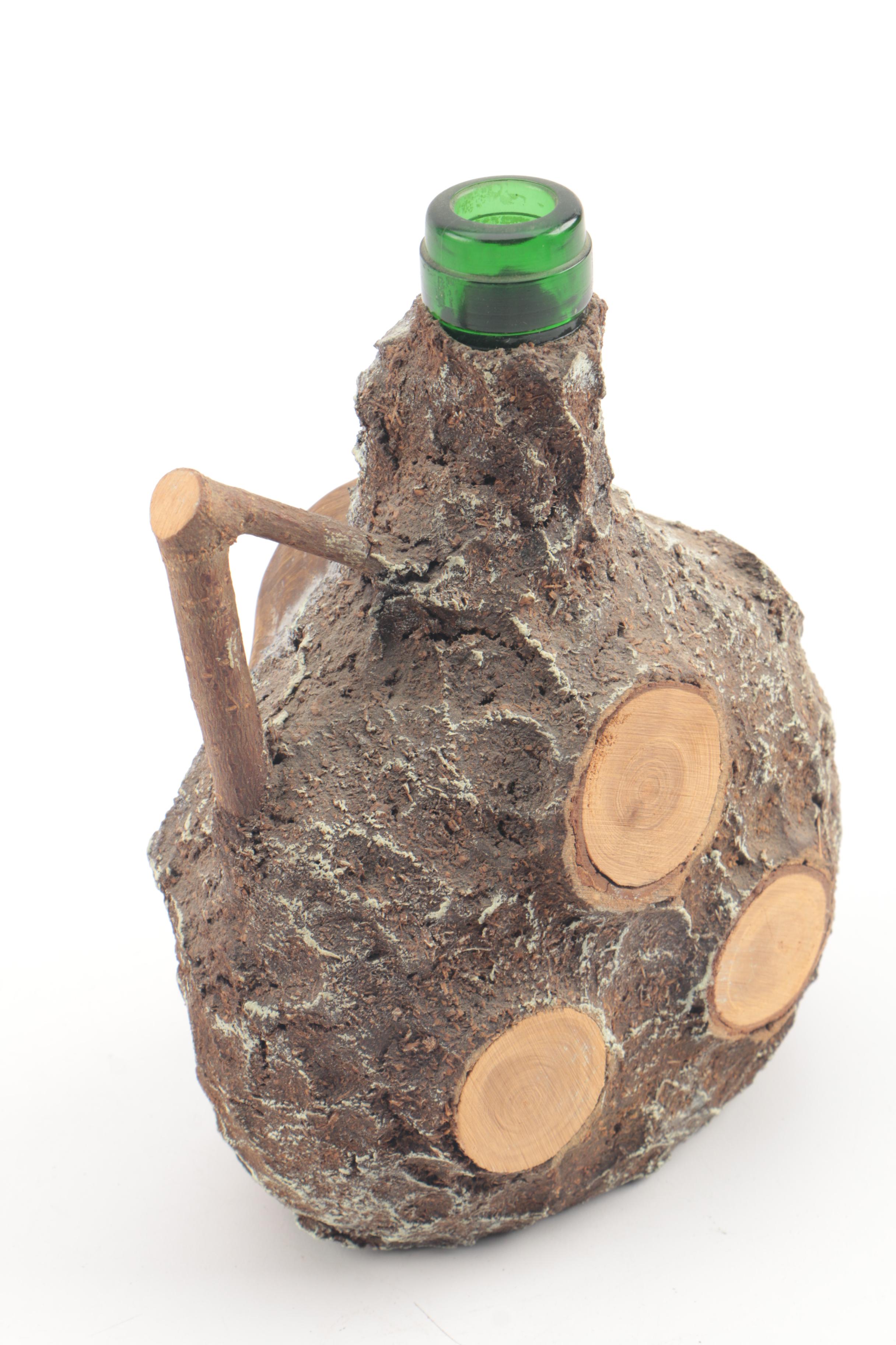 Vintage Folk Art Glass Bottle with Carved Wooden Face and Bark Exterior