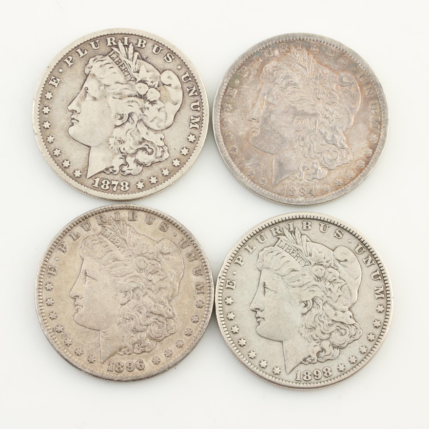 Group of Four Silver Morgan Dollars: 1878, 1884-O, 1896, and 1898