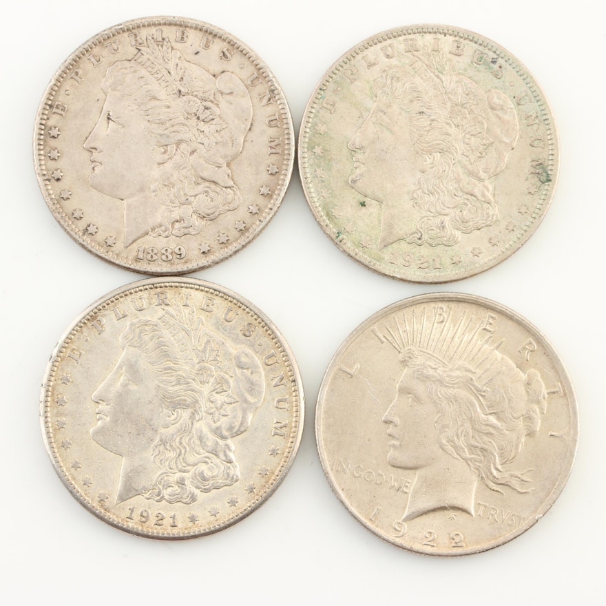 Group of Three Silver Morgan Dollars and One Silver Peace Dollar