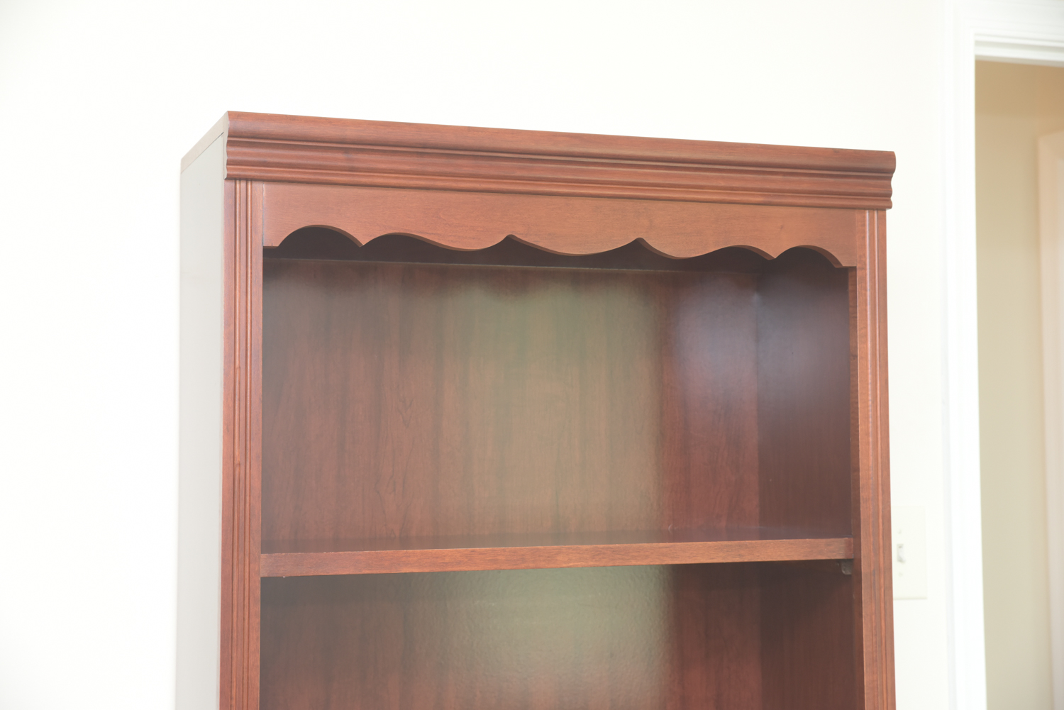Scallop Accented Wood Finished Laminate Bookcases
