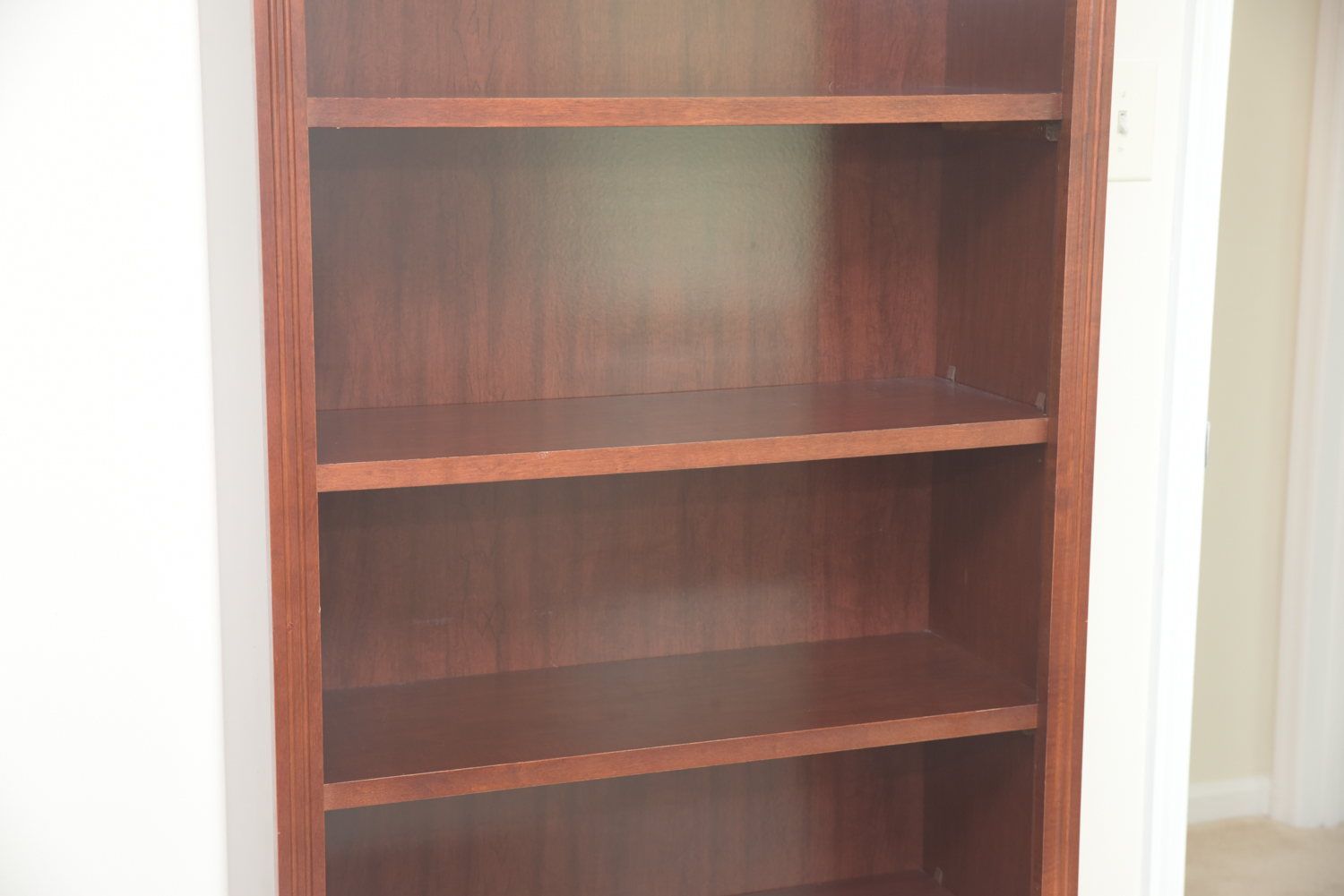 Scallop Accented Wood Finished Laminate Bookcases