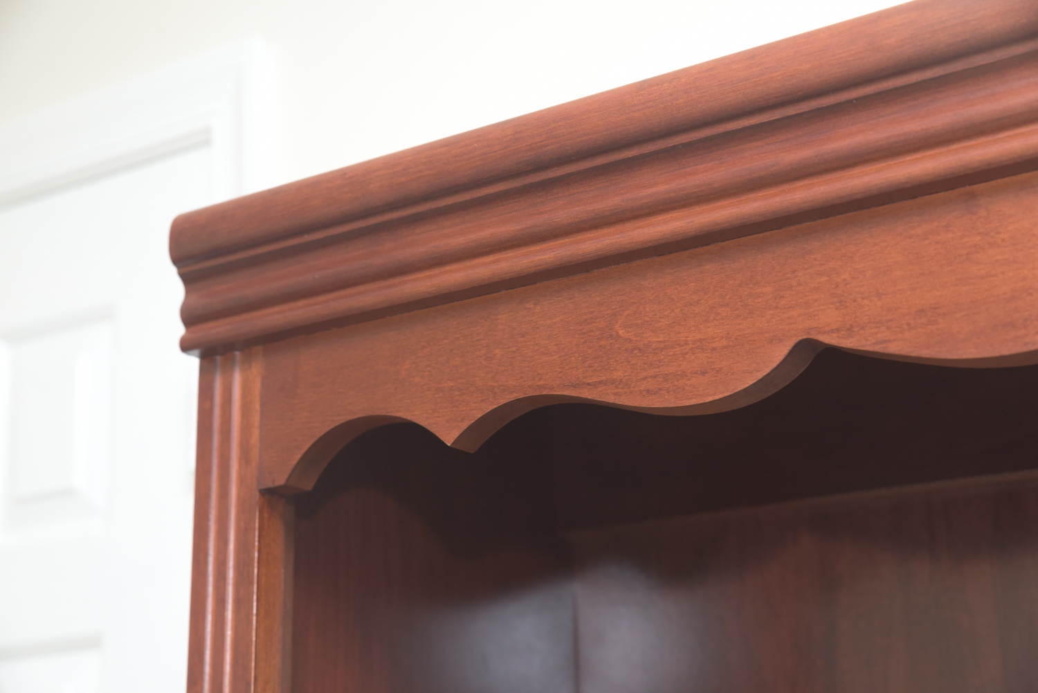 Scallop Accented Wood Finished Laminate Bookcases