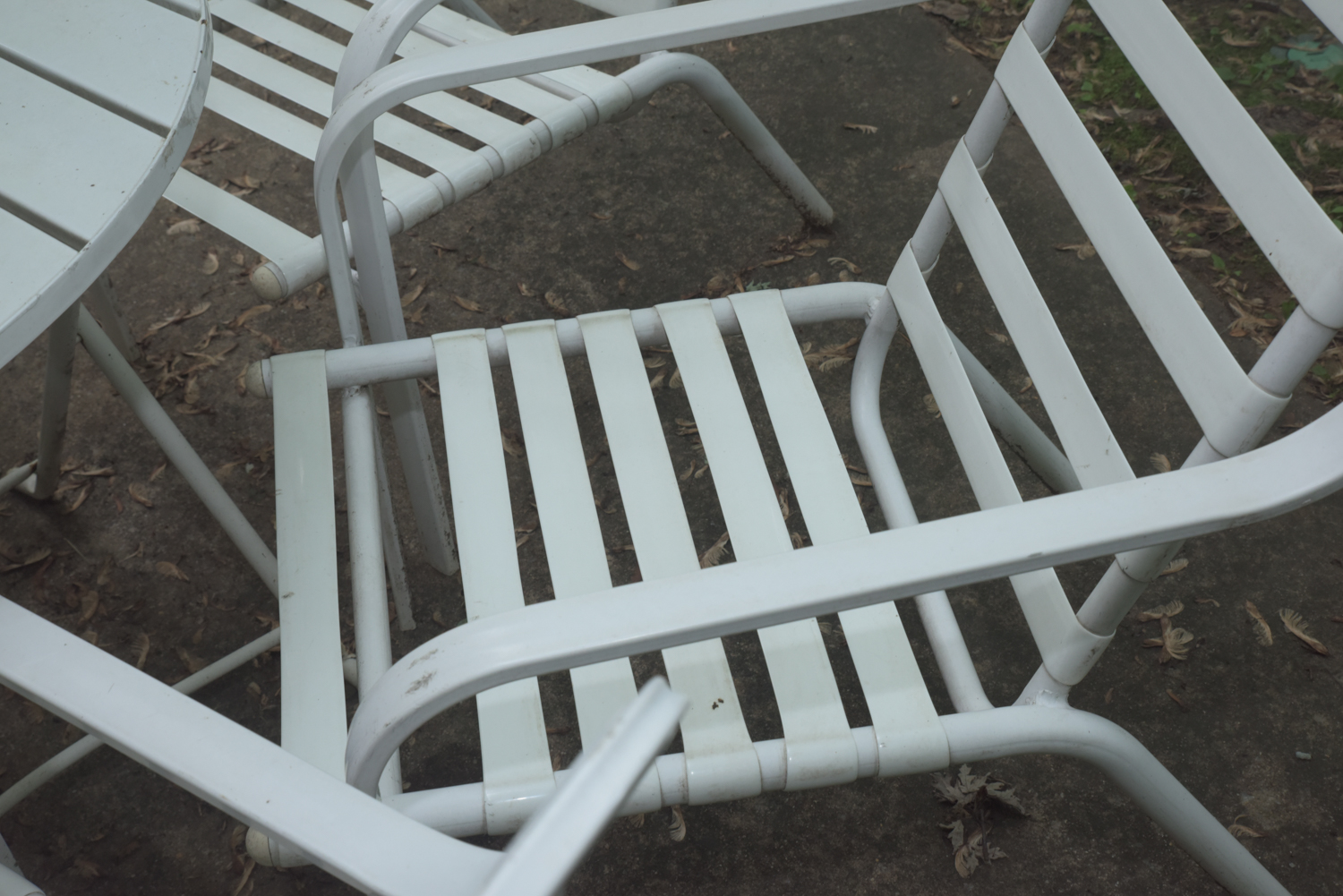 Five-Piece White Metal Patio Set with Seat Cushions