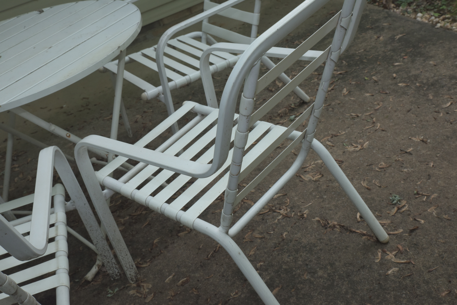 Five-Piece White Metal Patio Set with Seat Cushions