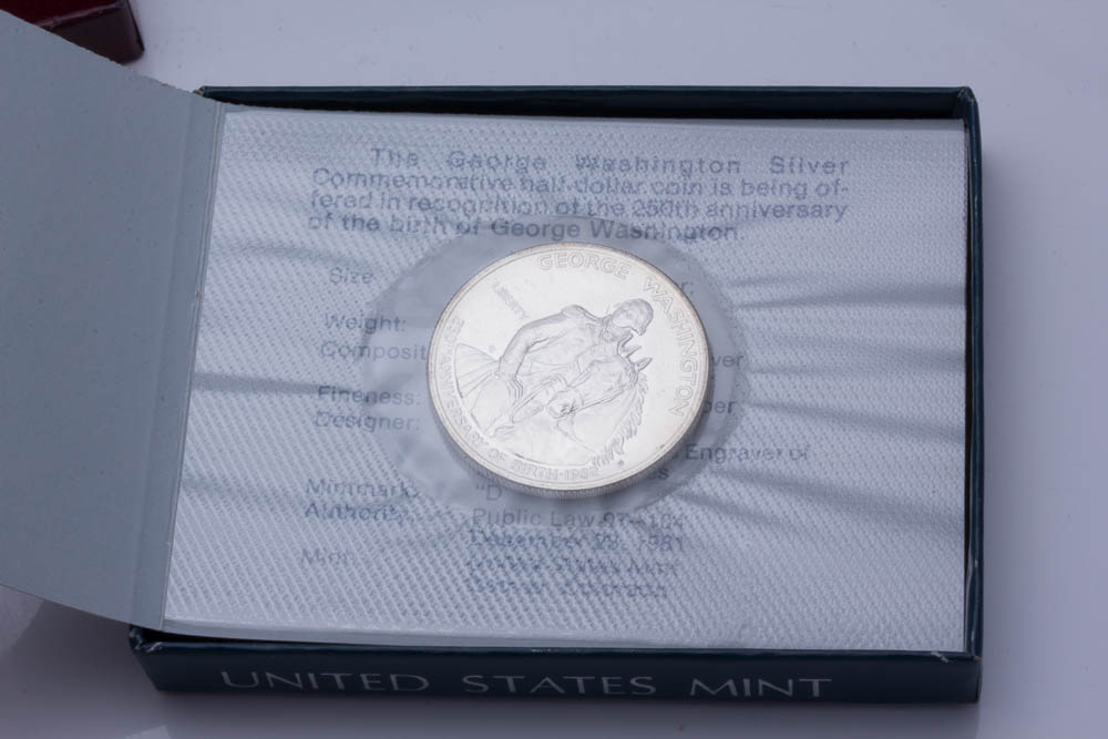 Silver Eisenhower Dollar and Two Commemorative Silver Half Dollars