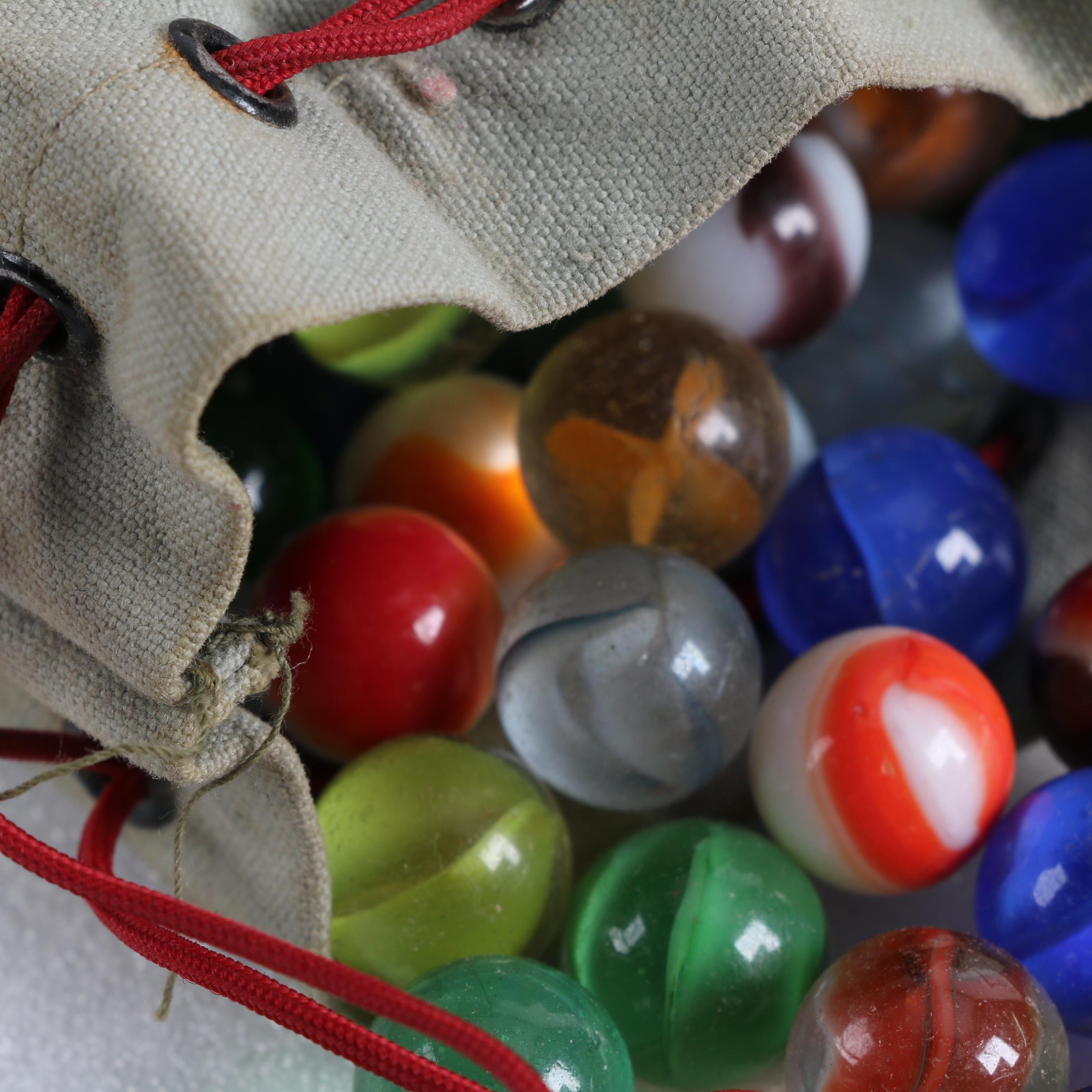 Glass Marble Collection in a Needham National Bank Canvas Drawstring Bag