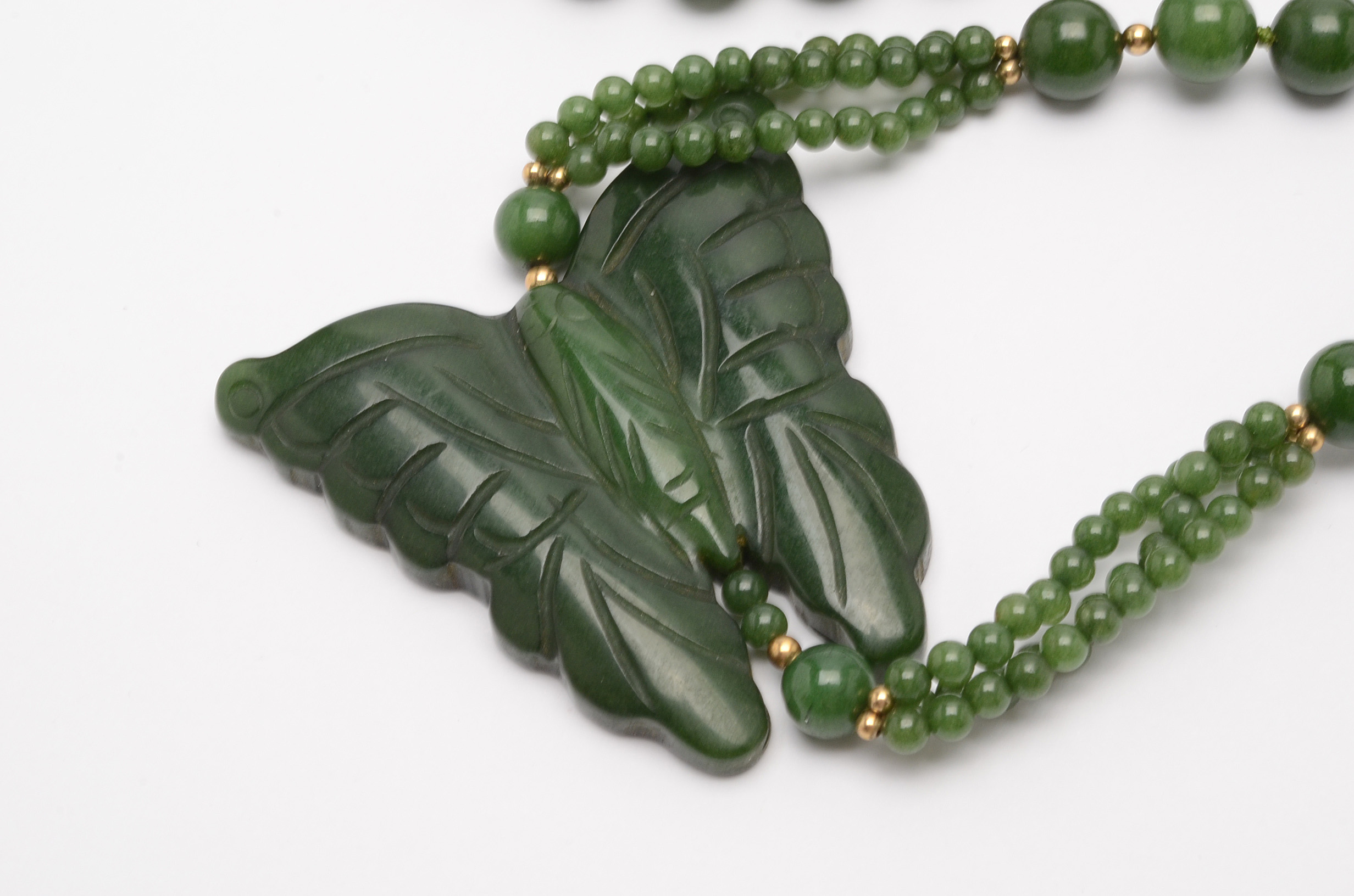 Beaded Nephrite Necklace Showcasing a Carved Butterfly Pendant