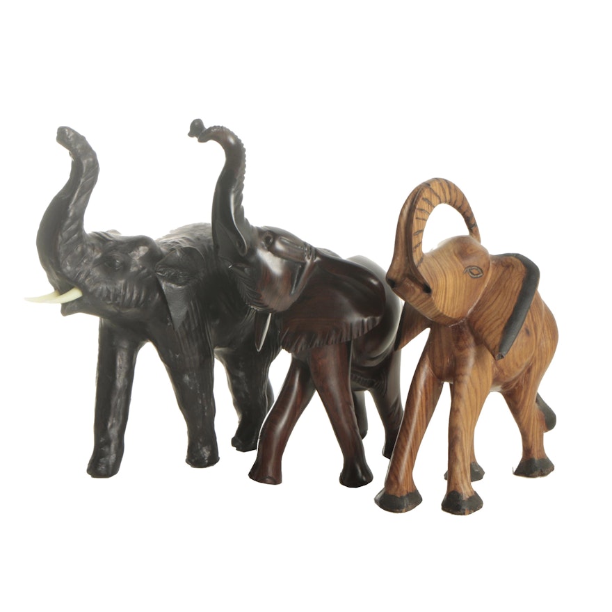 Black Leather and Carved Wooden Elephant Figurines