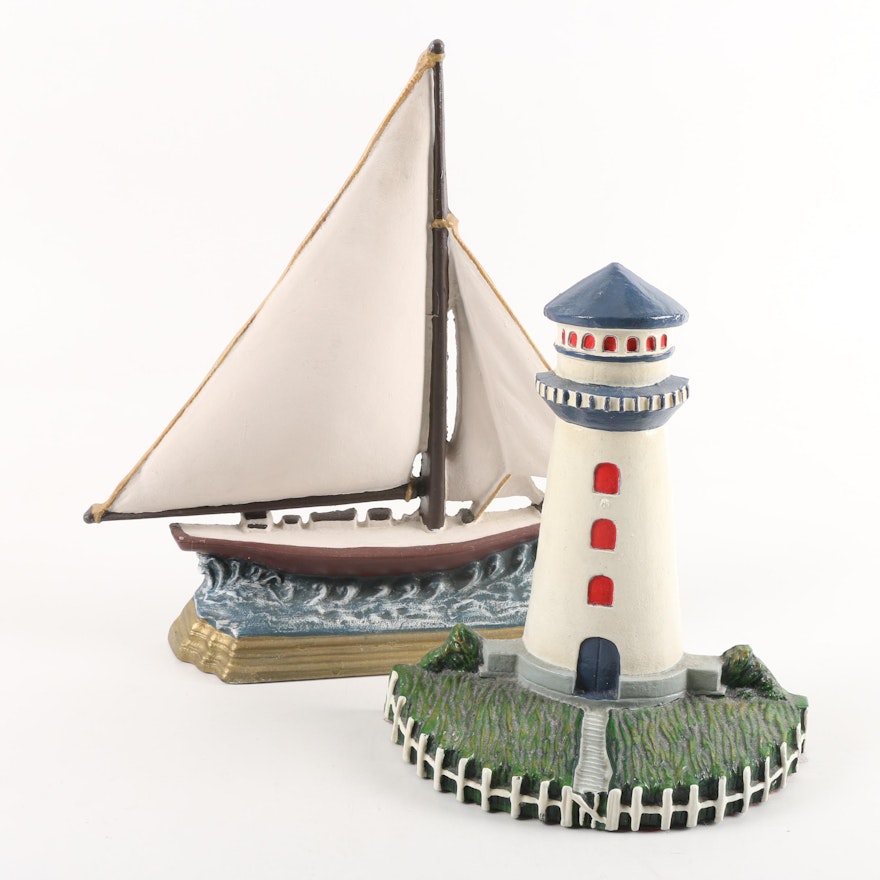 Painted Cast Iron Lighthouse and Sailboat Doorstops