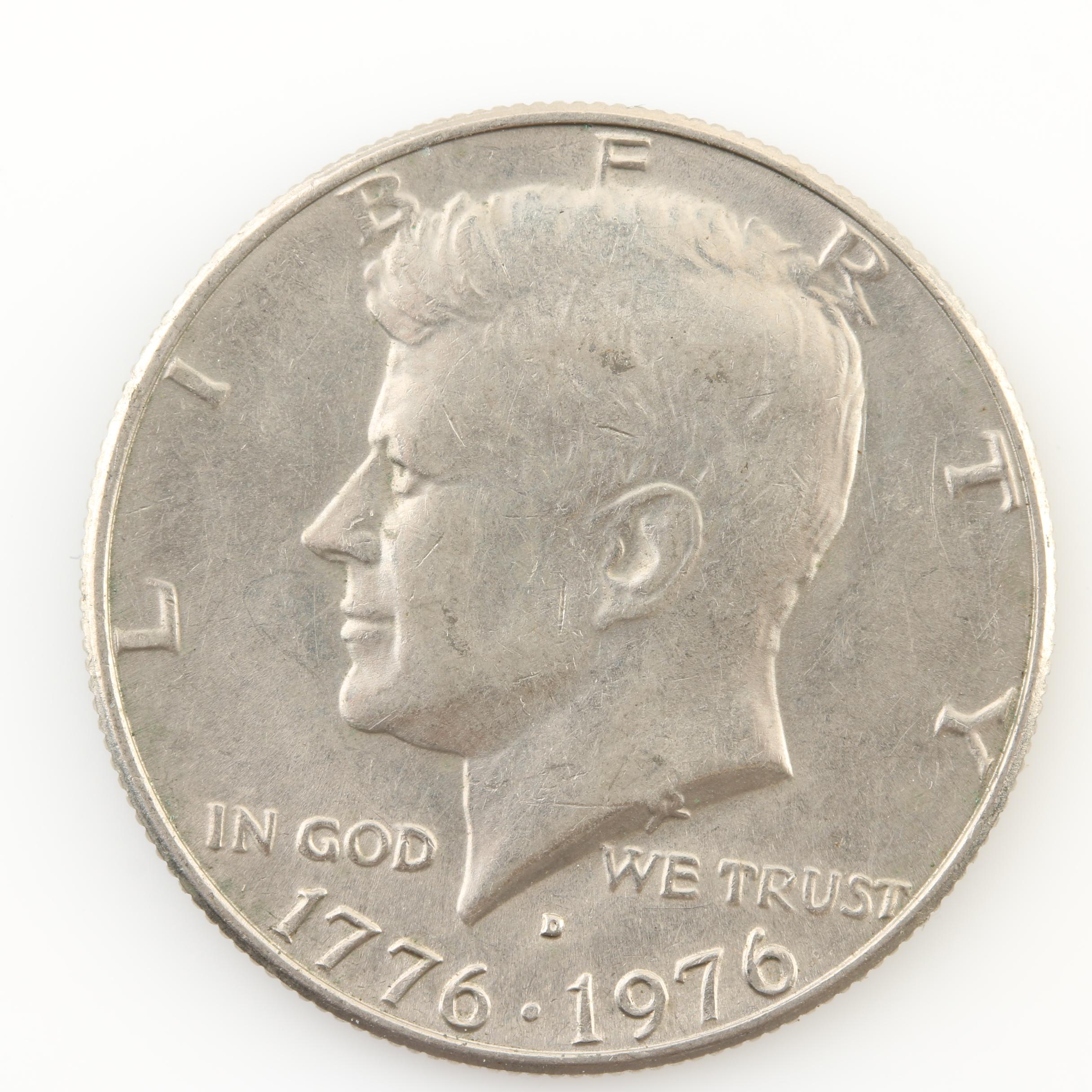 Group of Thirteen JFK Half Dollars and Three Susan B. Anthony Dollars