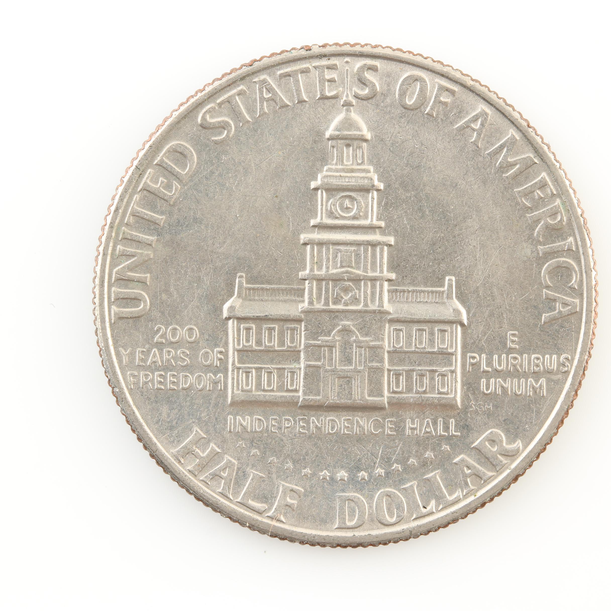 Group of Thirteen JFK Half Dollars and Three Susan B. Anthony Dollars