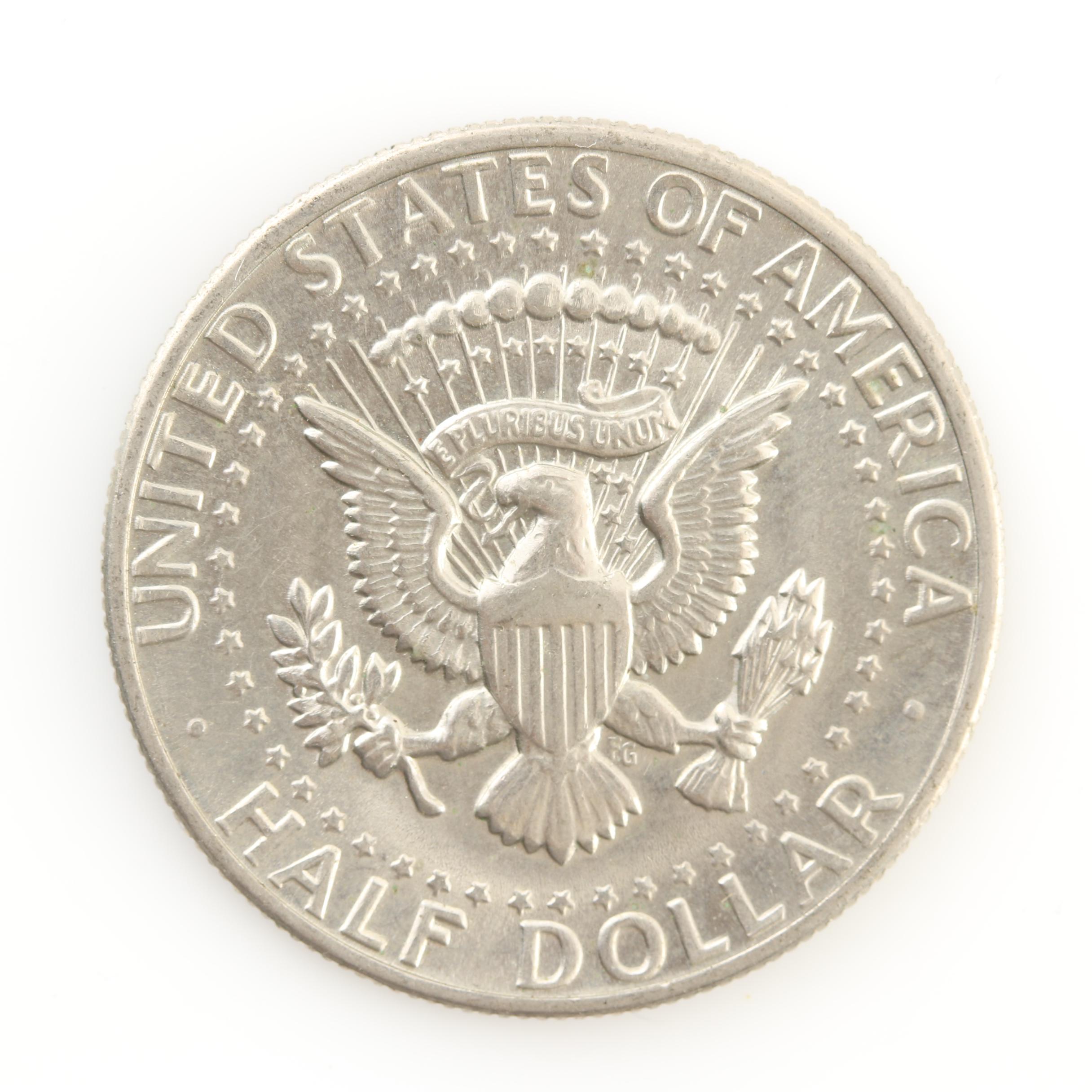 Group of Thirteen JFK Half Dollars and Three Susan B. Anthony Dollars