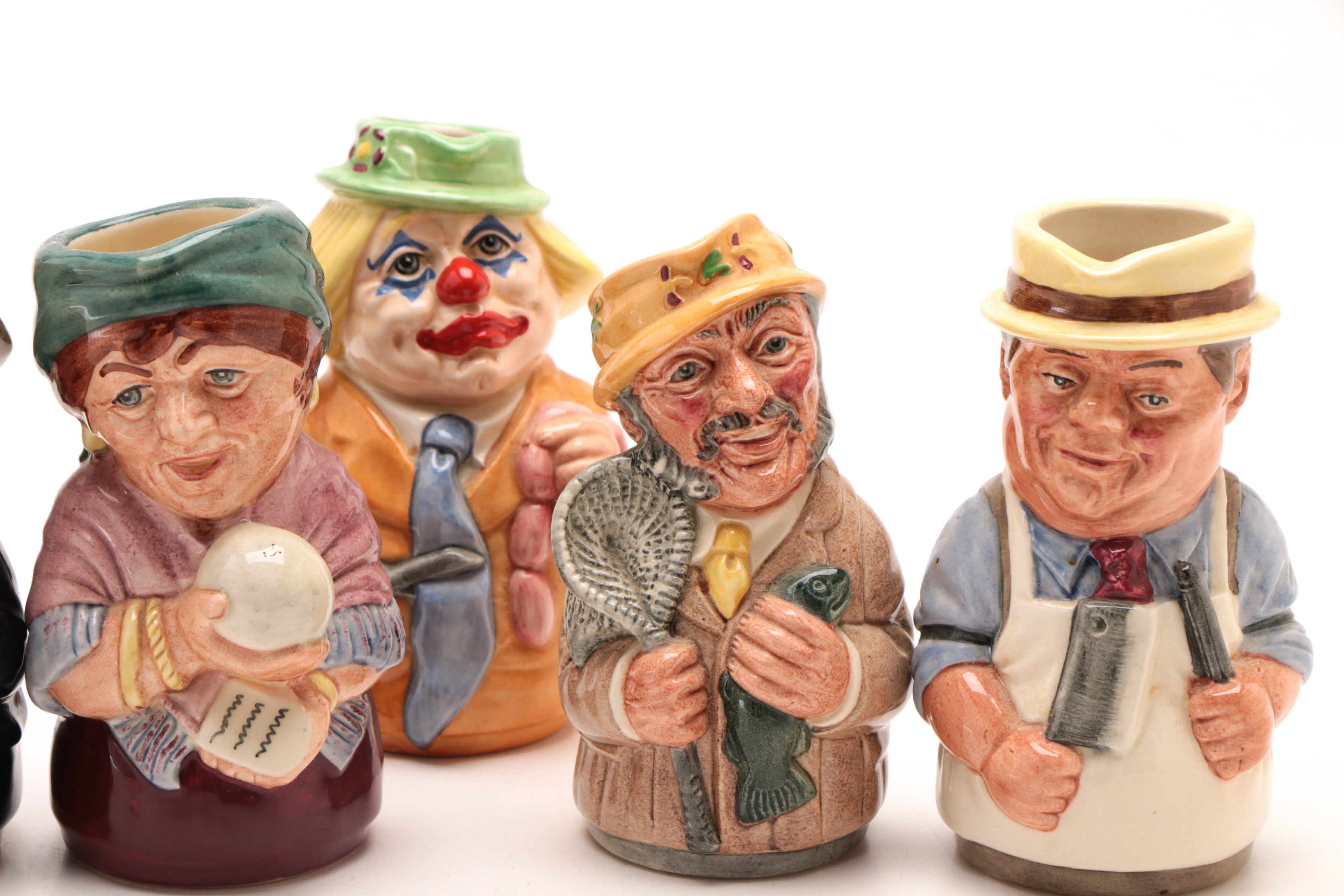 Group of Royal Doulton "The Doultonville Collection" Toby Jugs