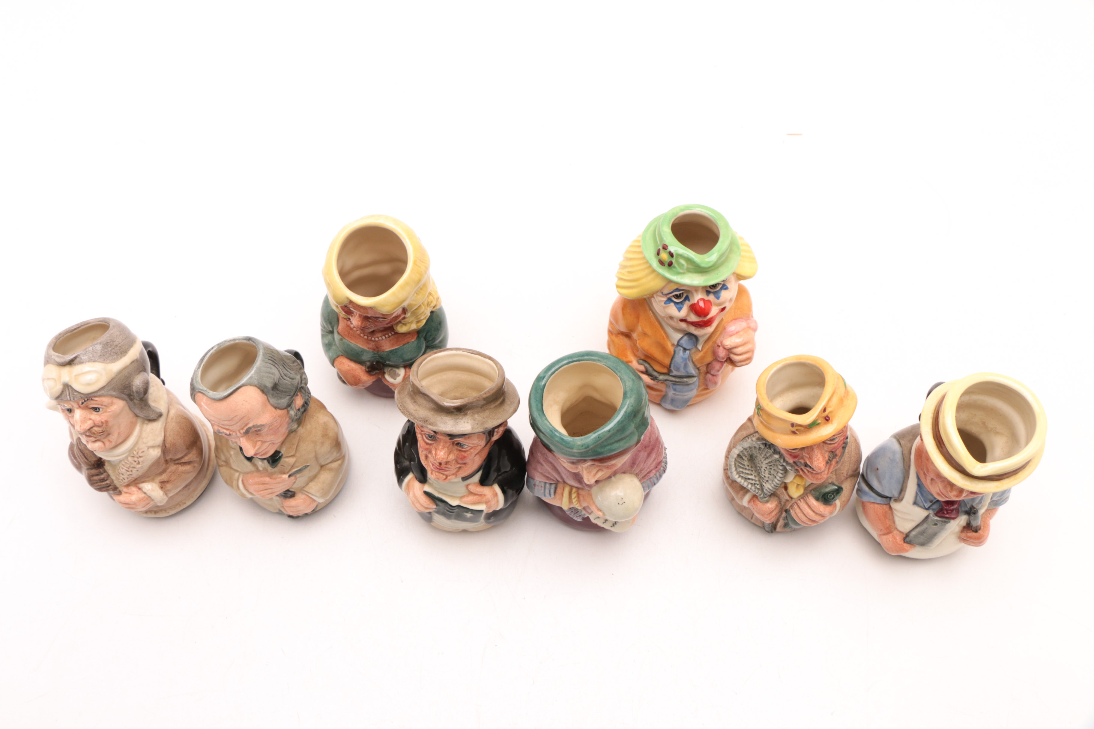 Group of Royal Doulton "The Doultonville Collection" Toby Jugs