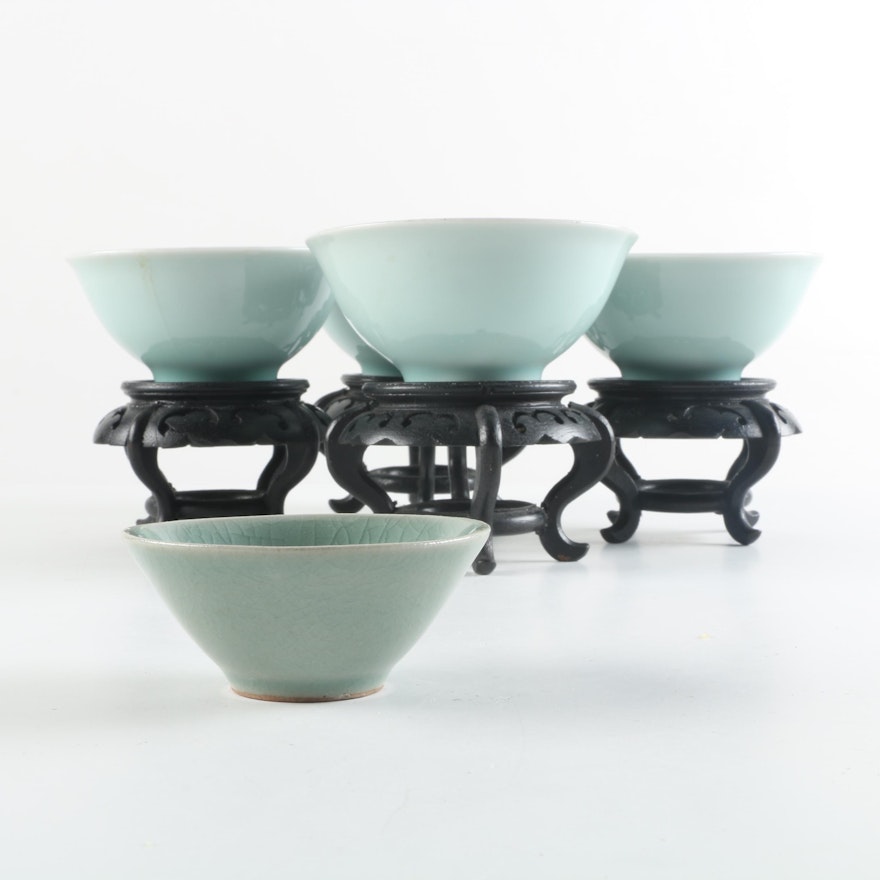 Footed Ceramic Bowls with Carved Wooden Stands