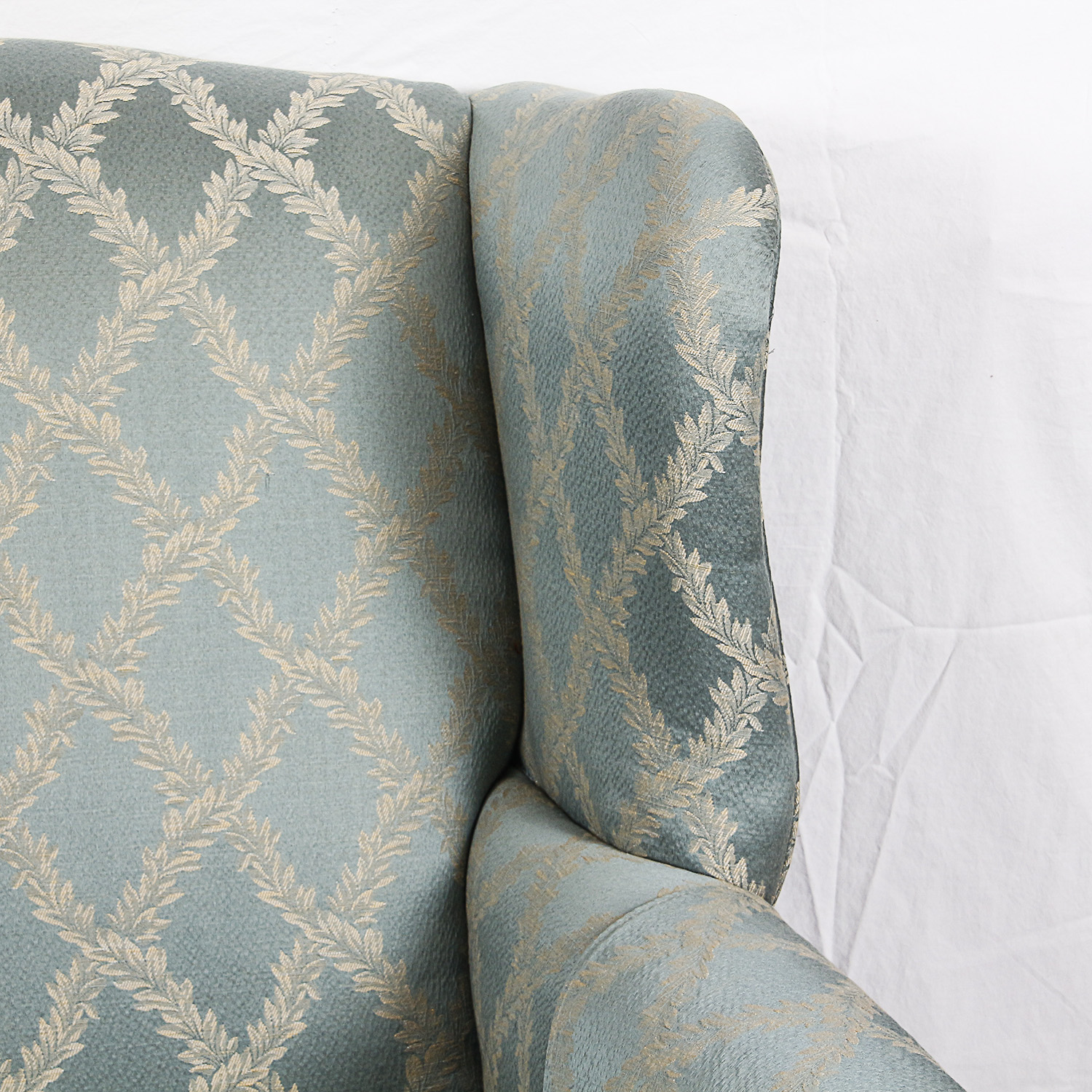 Blue Upholstered Wingback Chair and Ottoman