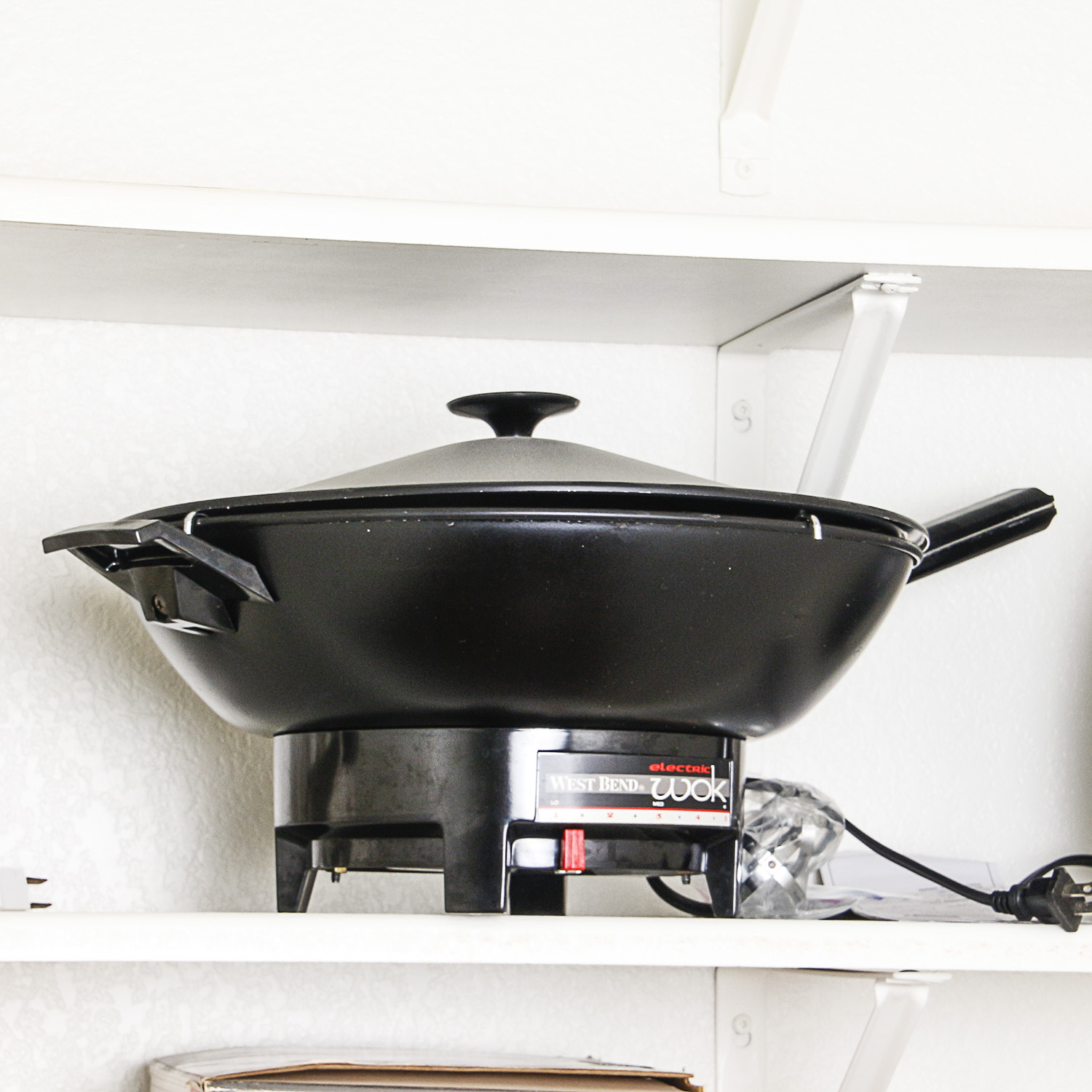 Small Kitchen Appliances including a Toaster Oven, Bread Maker, and Electric Wok