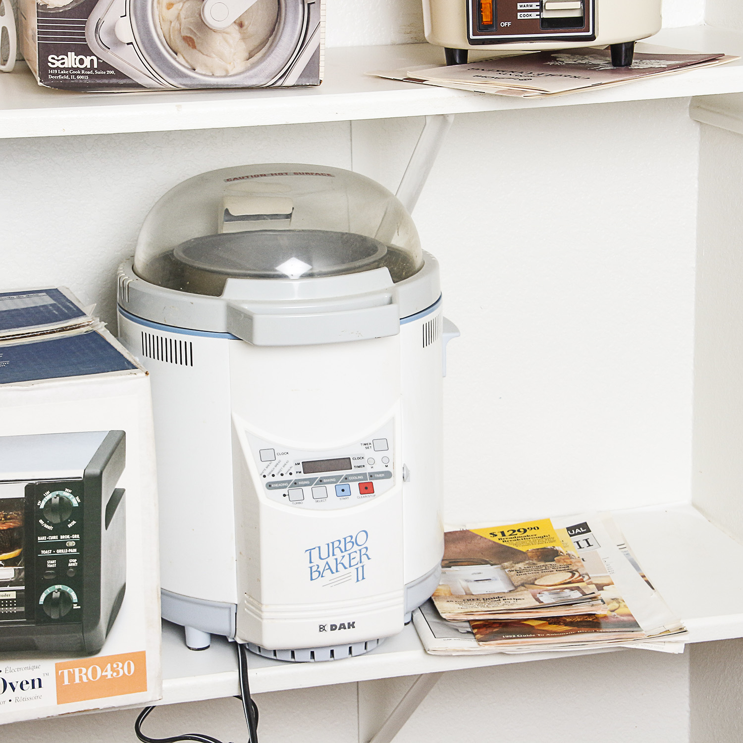 Small Kitchen Appliances including a Toaster Oven, Bread Maker, and Electric Wok